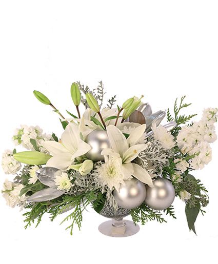 Silver Luster - Celebrate this special season with these radiant flowers! Filled with white lilies, stock, dusty miller, and seasonal greens, enjoy the spirit of the season with Silver Luster. This gorgeous arrangement is sure to make an elegant addition to any holiday table!
