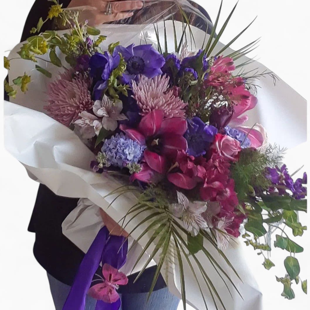 Her Favorite Is Purple Flowers Luxe Bouquet - All purple blossoms of the day; premium roses, lavish hydrangeas, fragrant stock and so much more arranged as a presentation bouquet ready to wow her. Bouquet is large and wrapped in my signature style with long flowing ribbons and butterflies.