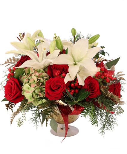 Lavish Lili Ros - Impress your holiday guests with this stunning holiday classic! Filled with red roses, white lilies, and green hydrangeas, this centerpiece is full of extravagance and grace. Make your holiday table the talk of any party with the Lavish Lilies &amp; Roses bouquet!