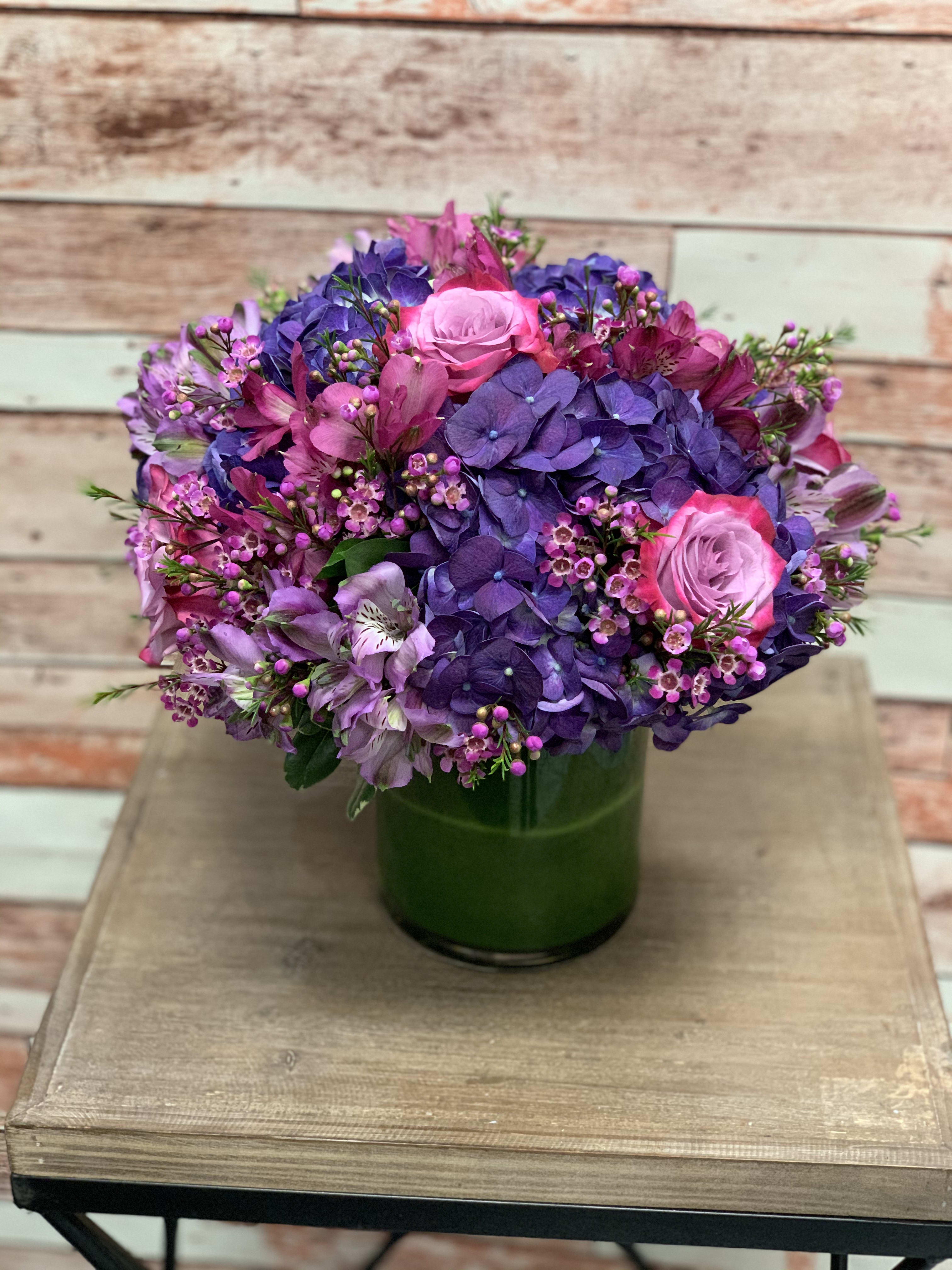 Jolly Violets  - A beautiful arrangement full or purple and magenta colored flowers perfect for a spring time celebration!  