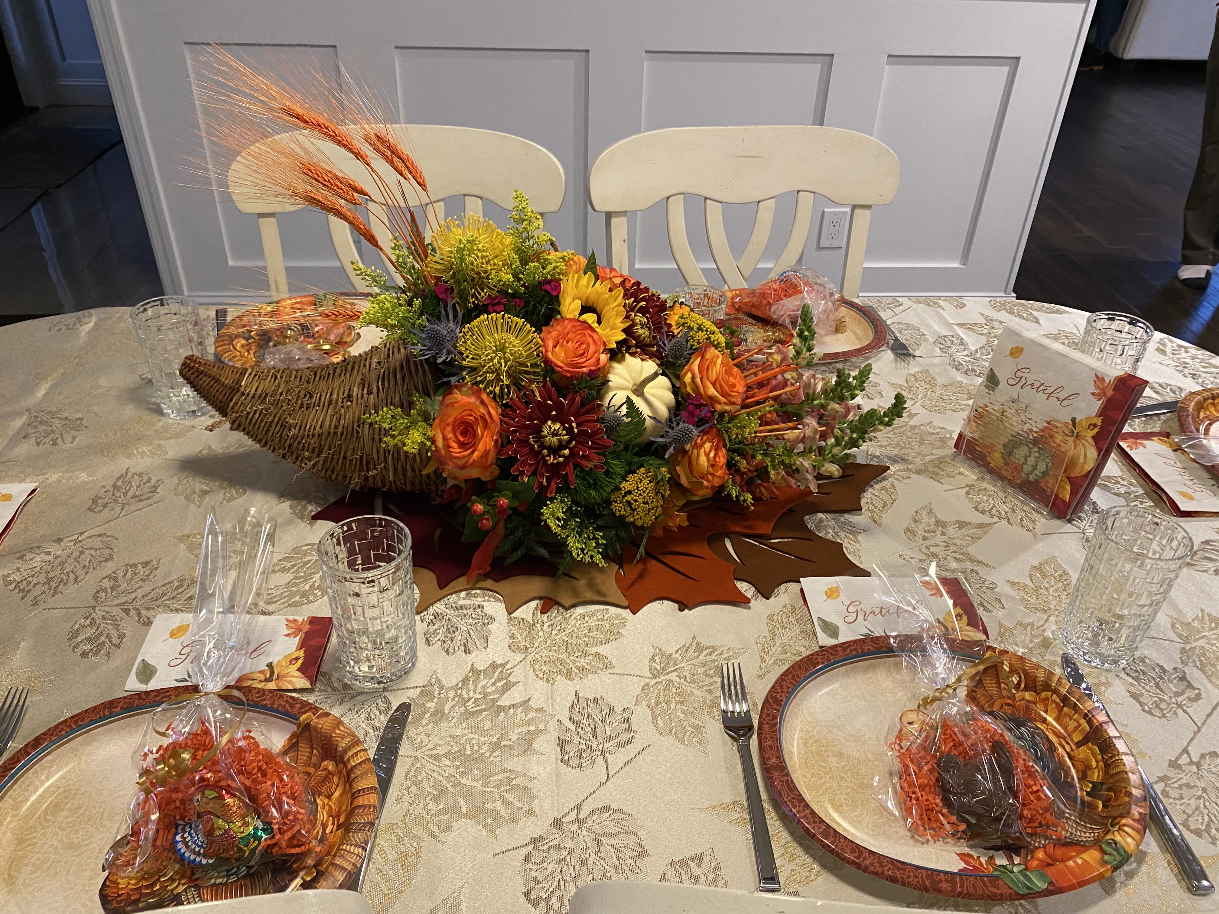 Abundant Horn Of Plenty - An stunning abundance of seasonal fall flowers are perfectly arranged in a wicker cornucopia.  It’s a wonderful centerpiece to adorn your holiday table…Now you know why cornucopia translates to &quot;horn of plenty.&quot; 