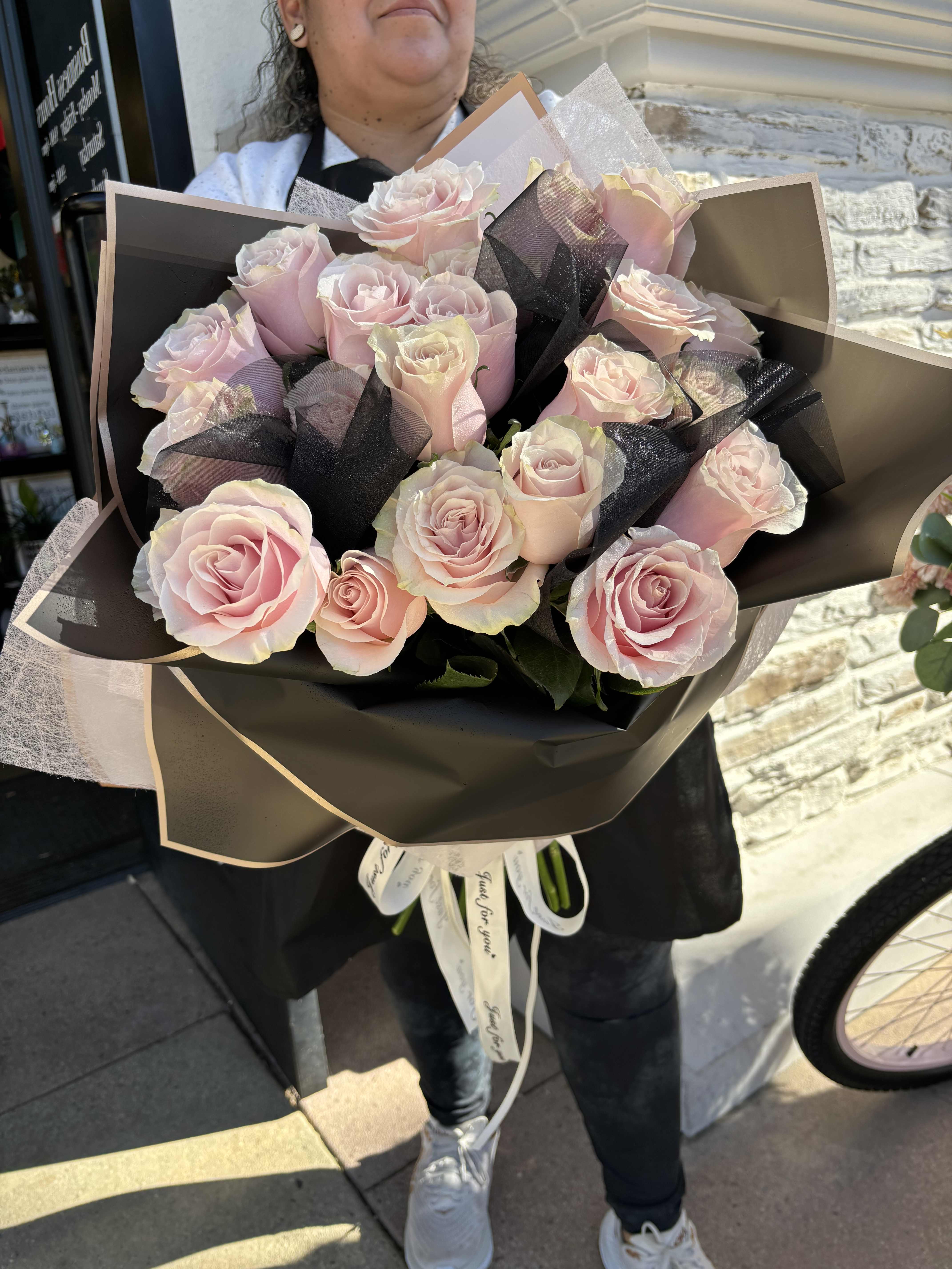 Pink Rose Elegant Wrap - 2 Dozen Pink Roses Wrapped in Black Flower Paper and Tulle, tied in Just For You ribbon. 