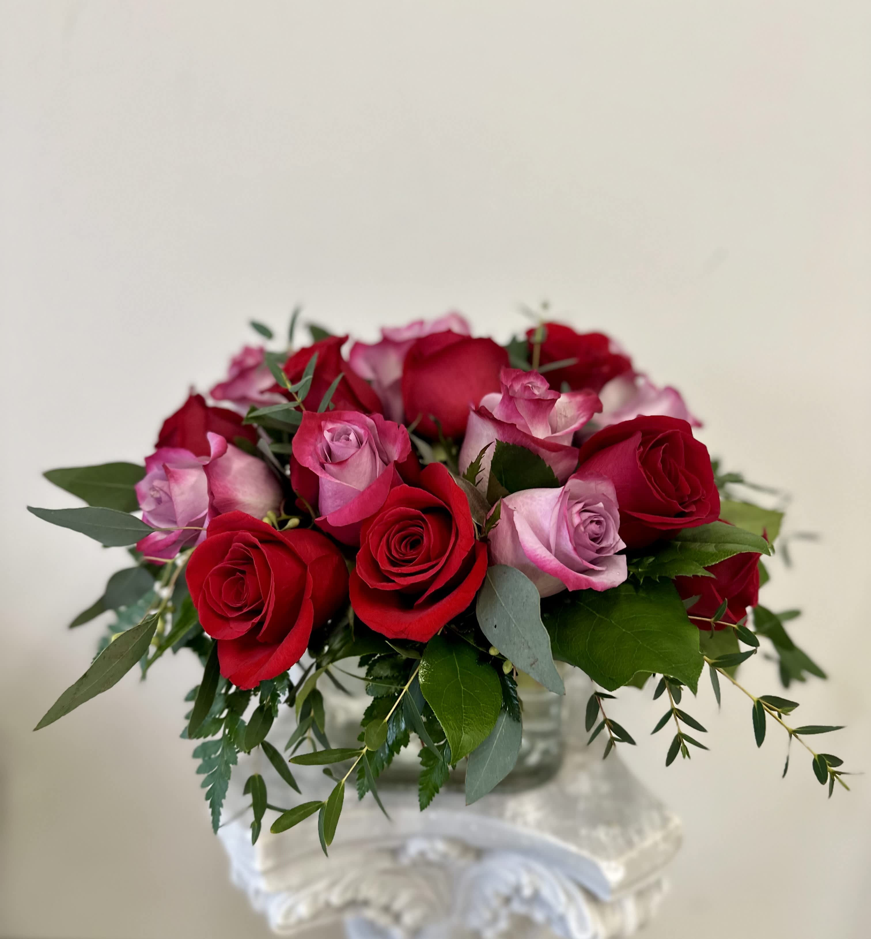 Sparks Fly by Westford Florist Art by Veny - Elevate your expressions of love and appreciation with the Sparks Fly flower arrangement by Westford Florist Art by Veny. This exquisite display artfully blends deep red and soft lavender roses, capturing a perfect balance between passion and tranquility. Each bloom is thoughtfully arranged to create a captivating visual that resonates with heartfelt emotions. Ideal for anniversaries, romantic gestures, or simply to brighten someone's day, this modern masterpiece will surely ignite sparks in any relationship. Make every sentiment unforgettable with the enchanting beauty of Sparks Fly—where elegance meets emotion. At Westford Florist, we understand that every relationship is unique and special in its own way. That's why we offer customizable options with our Sparks Fly bouquet so you can add a personal touch and make it even more meaningful for your loved one. Ordering from us is simple – just give us a call or visit our website to place your order today. Our dedicated team will handle everything from selecting the freshest flowers to arranging them beautifully into a stylish bouquet that will surely impress your significant other. Don't wait for a special occasion – show your love and admiration for that special person in your life with Westford Florist's stunning Sparks Fly flower arrangement. Order now and watch the sparks fly in your relationship!