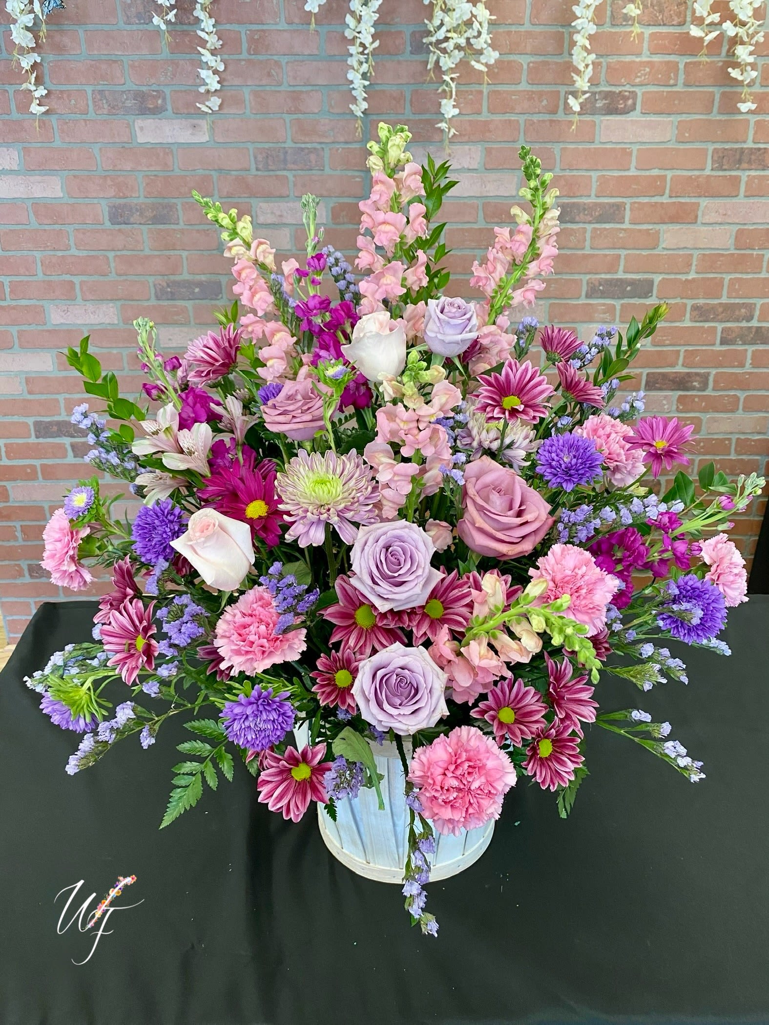 Loving Grace - Feminine berry tones blend in a basket for a beautiful display 
