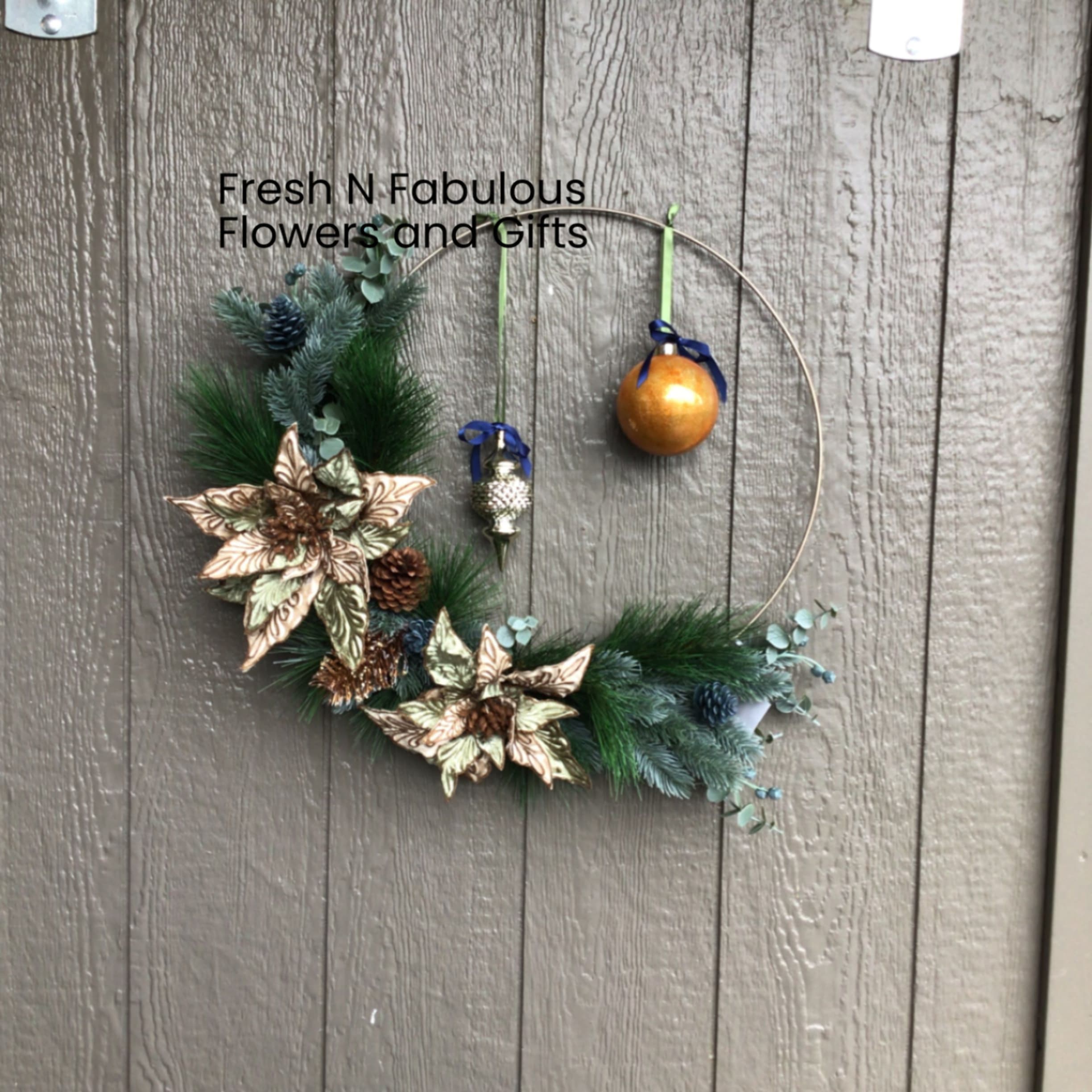 Christmas Magic Wreath - A wreath done in the calming colors of sage greens, browns and accents of gold.  Featuring a modern twist on the texture and colouring of the poinsettia’s. This wreath will add a certain Christmas charm to any door or room in your home.
