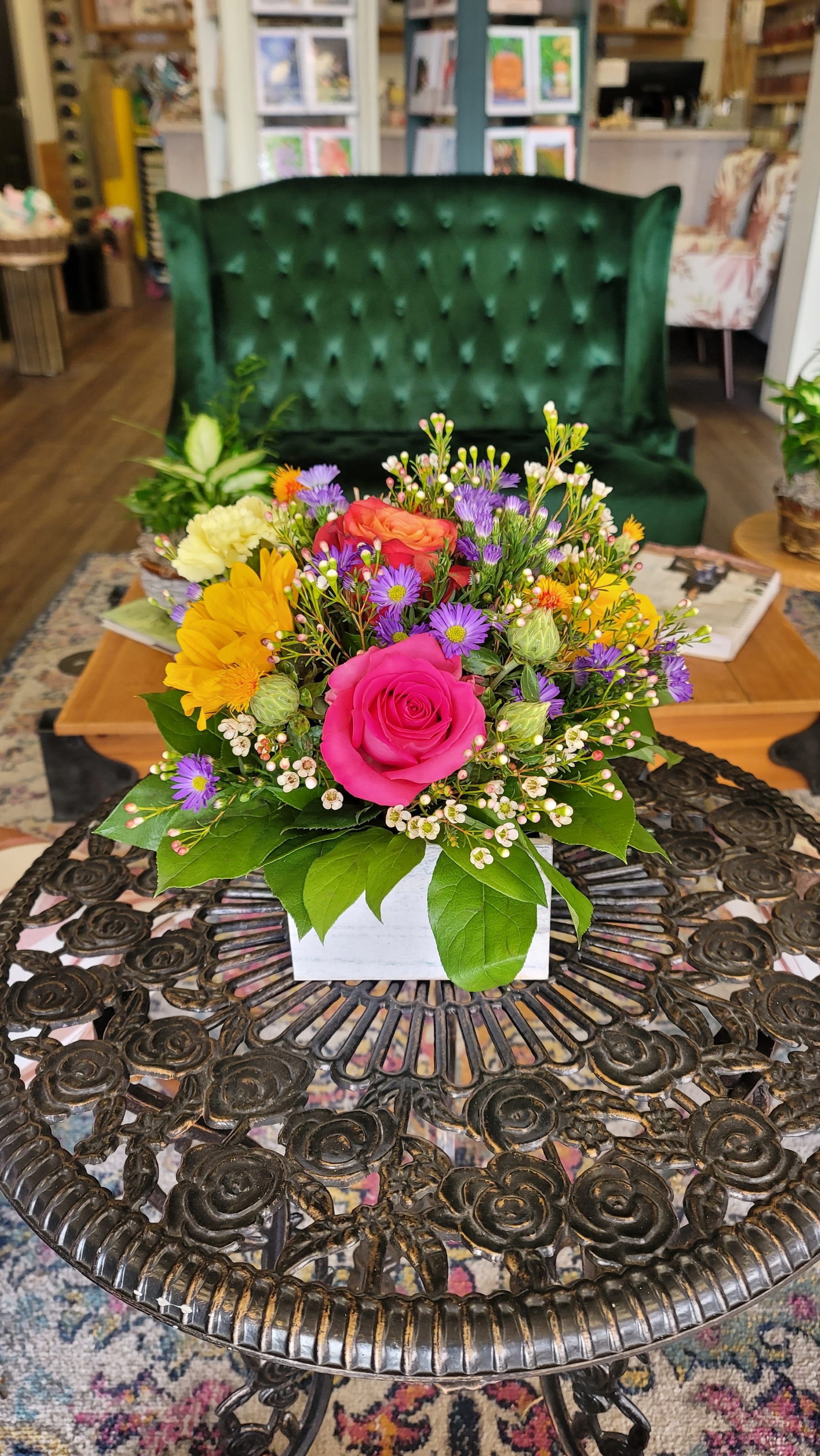 Family centerpiece - Enjoy this 6&quot;X6&quot; wooden centerpiece for your family's Holiday gathering. stands 12&quot;tall and has sunflower, roses, wax flower daisy's, carnations and purple Aster flower.