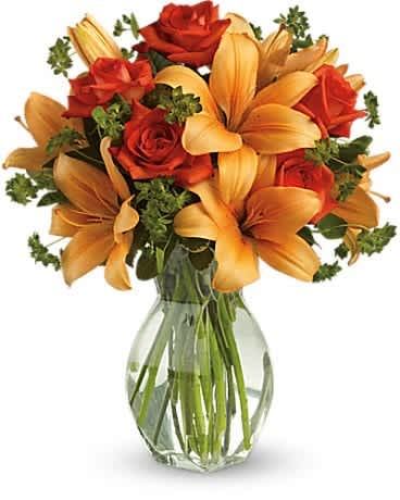 Fiery Lily and Rose - Spark someone's attention by sending this absolutely radiant bouquet. Full of flowers and fiery beauty, it makes a beautiful gift for any occasion. Features dark orange roses and orange asiatic lilies in a charming glass vase. It's fiery and it's fabulous!Approximately 15" W x 18" H