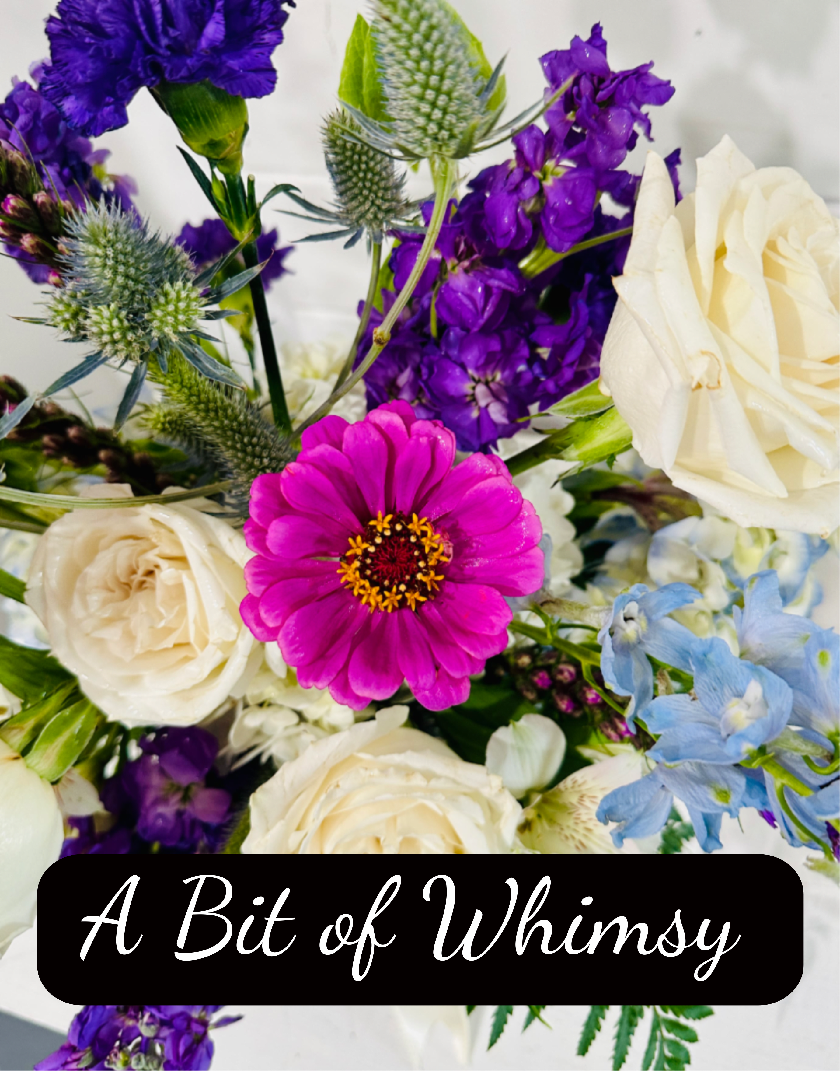 Whimsical designers choice - For those who love a more whimsical look to their floral arrangements.  This beauty will always be one of a kind.  Beautiful blooms that have a mind of their own prove to create a unique shape and color scheme every time!  Enjoy!