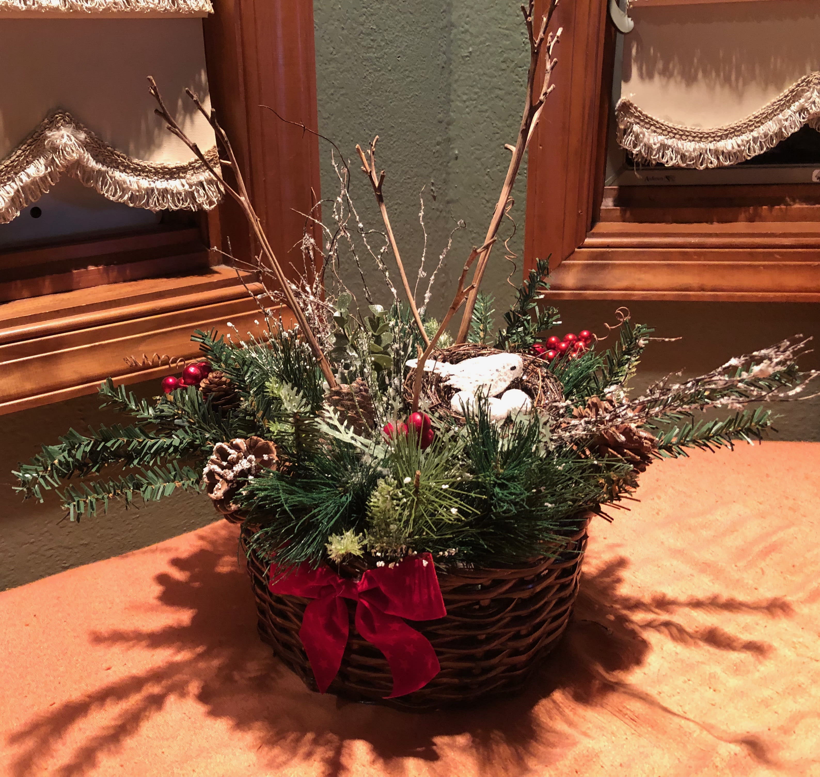 Reindeer Games - Long lasting decorative accents  &amp; preserved branches with Christmas greenery, pinecones  &amp; berries. A little snowbird watches over her 3 eggs within the sturdy holiday basket. Great item to store after the holidays and use year after year. Sure to become a holiday keepsake. Approx. Dimensions; 8&quot;round  X 12&quot; high (only 1 available)