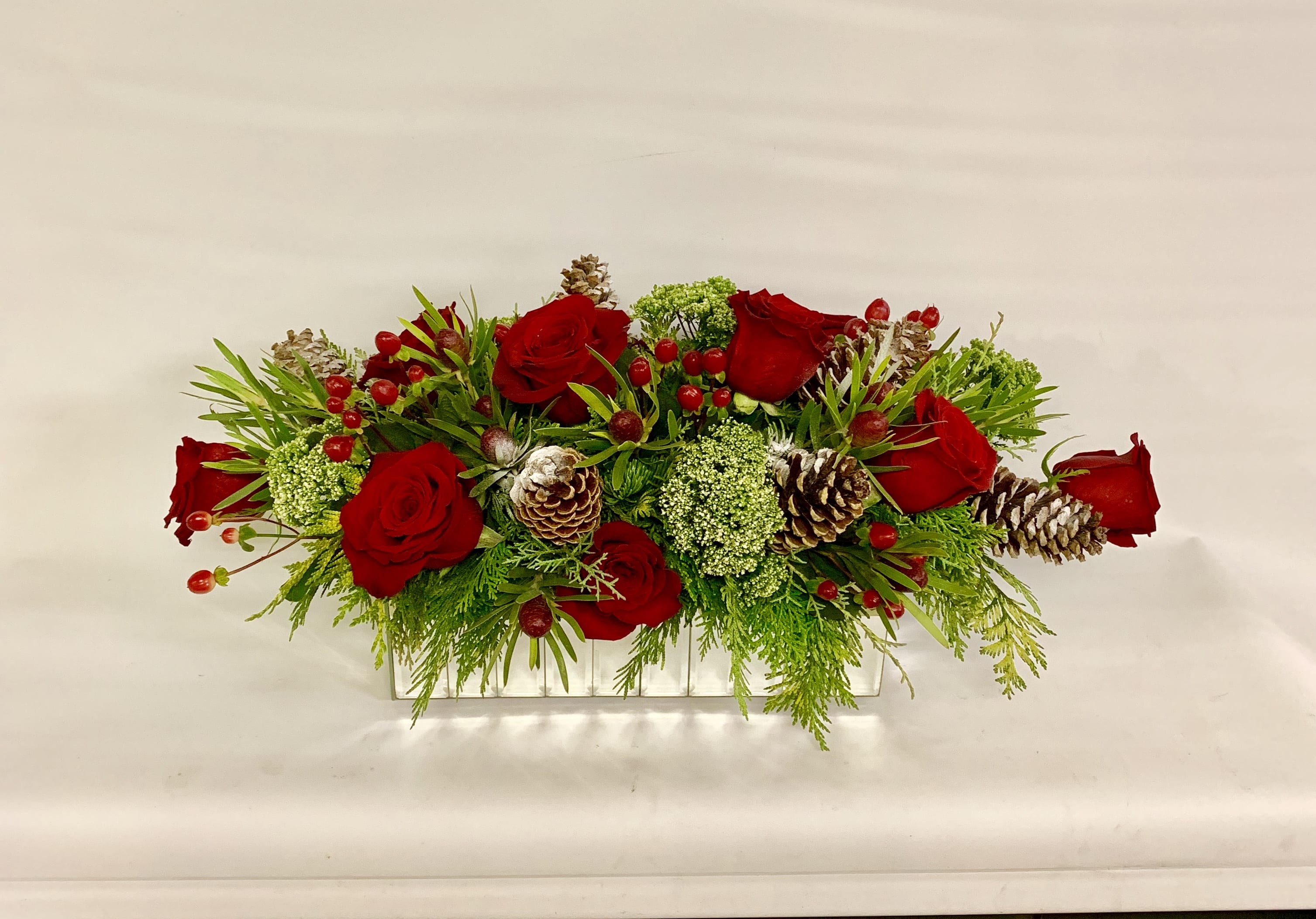 Season's Greetings - Take an Elegant Mirrored Container and Fill With a Lush Assortment of Mixed Evergreens, Roses, Hypericum and Pine Cones and You Have  a Winner for Your Home.