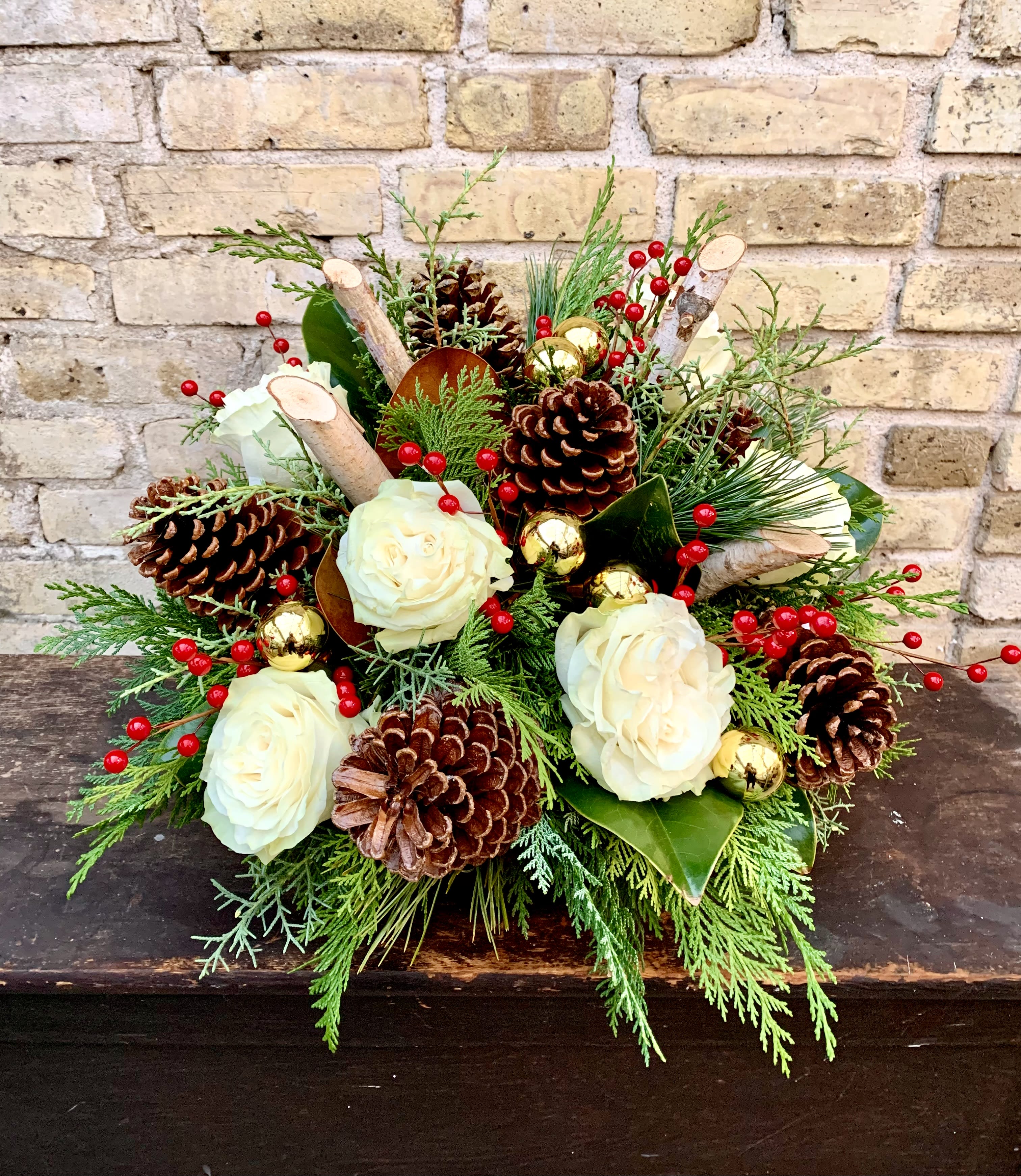 Starry Night - Beautiful Assortment of Winter Greens, Red Berries,  Pine Cones White Roses, Birch Logs and Holiday Bling.  Designed in a Ceramic Container. 