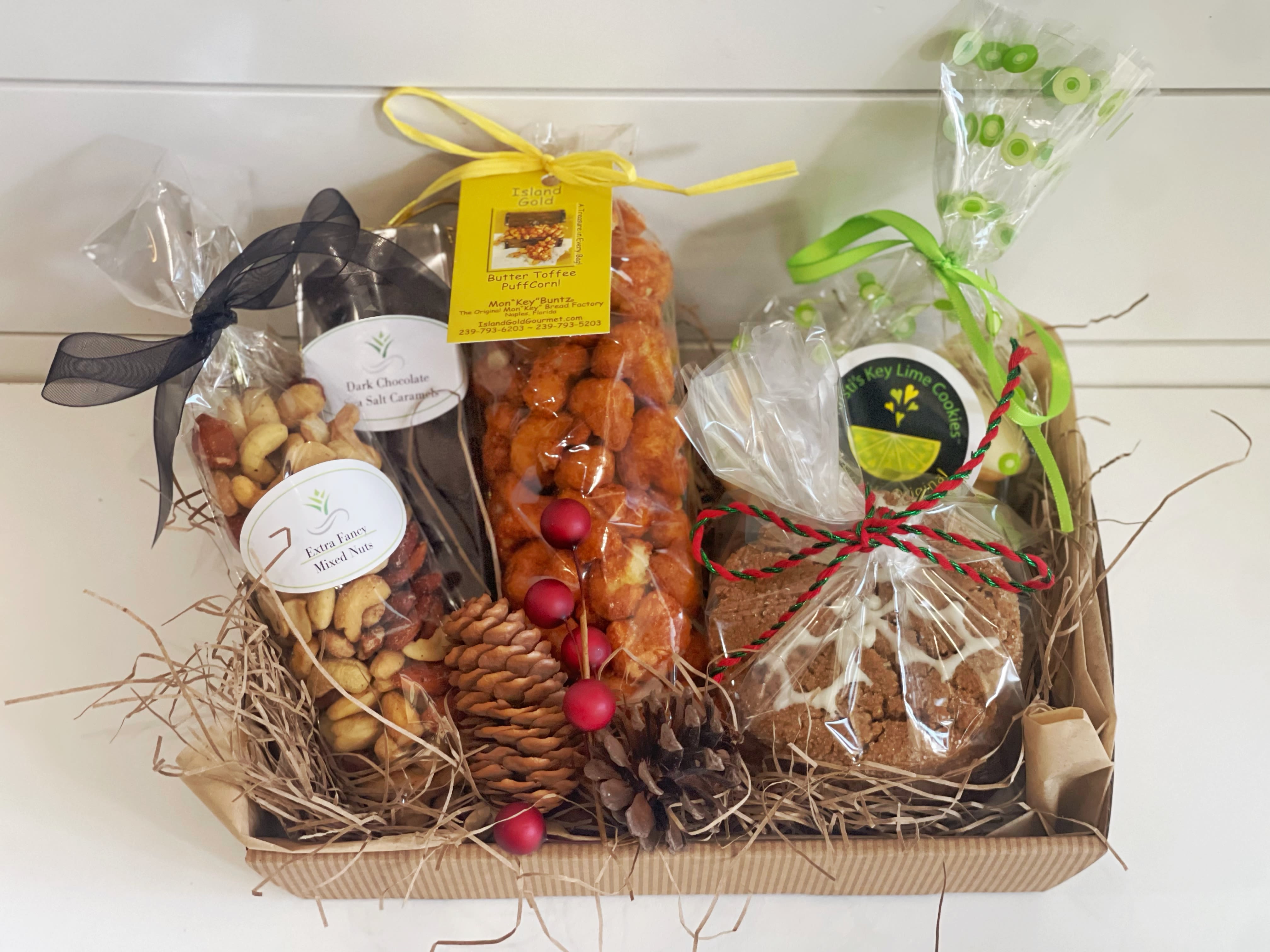 Local Treats, mini basket (Christmas edition) - Gift something unique, full of local treats: -Fresh molasses Ginger Christmas cookies -deluxe mixed nuts -dark chocolate sea salt caramels -Kristi’s key lime cookies -Toffee Puffed Corn from Mon”key” Buntz @Tin City Wrapped in cellophane and tied with a Christmas ribbon