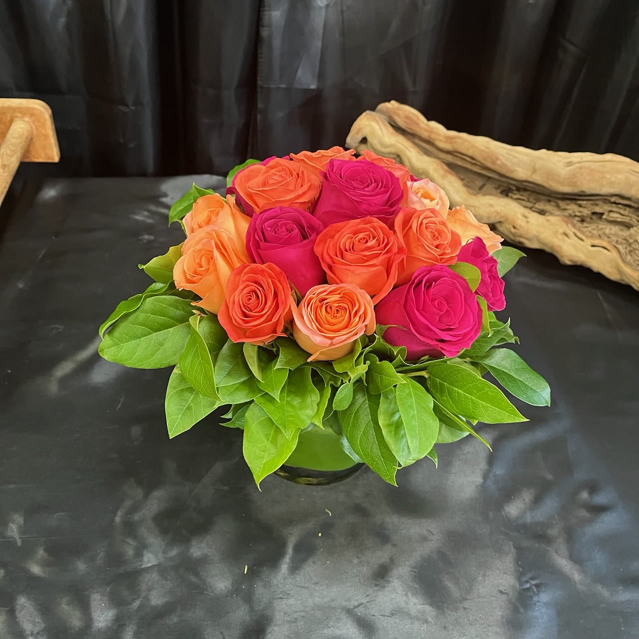 European Design 5 - A beautiful European design of roses with premium greenery in a clear glass square vase.