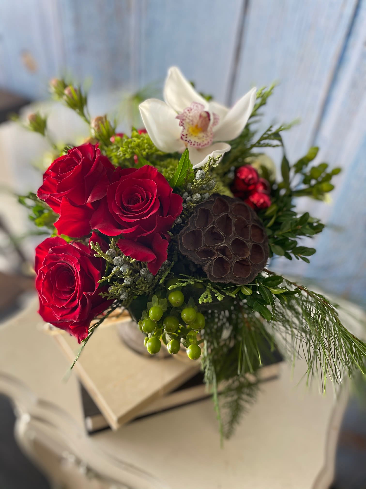 A CASA Holiday Bouquet - This beautiful classic will not only make someone smile, but a portion of this product at each Price point goes directly to CASA, Court Appointed Special Advocates, assisting the needs of young people in our community as they navigate the court systems, through the most unfortunate of circumstances.   Available for delivery from November 25th through the Holiday Season. 