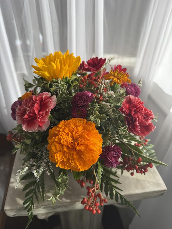 Lil Bit of Fall Centerpiece - A touch of fall color for your Thanksgiving table.  At only 9&quot; x 11&quot;, this little arrangement packs a punch!  Call the shop to find out exactly what we'll be using because our inventory constantly changes; so we may substitute.