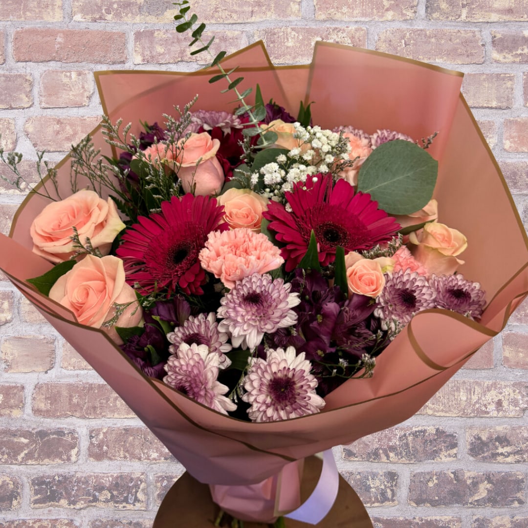 Day in Madrid - Hand held bouquet of mix florals with filler, luxury wrap.