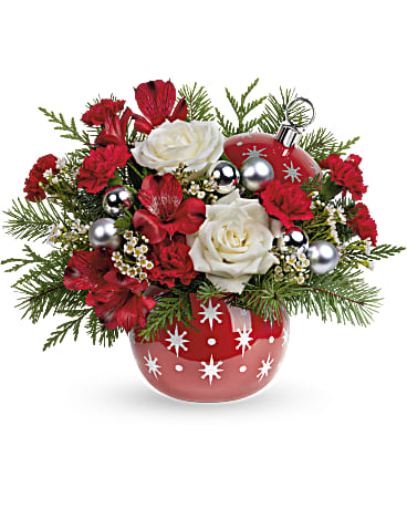 Twinkling Stars Bouquet - Make Christmas twinkle with this bouquet of snow white roses and fresh winter greens, arranged in a festive, hand-painted ceramic ornament jar with sparkling stars. Later, it's perfect for wrapped candies and other holiday items! Teleflora's Twinkling Stars Bouquet features white roses, red alstroemeria, miniature red carnations and white waxflower arranged with cedar and douglas fir. This holiday arrangement is delivered in Teleflora's Twinkling Stars Ornament.