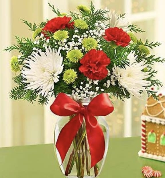 Festive Fields Christmas Bouquet - Always a best seller, the Fields of Europe - Christmas Bouquet is now available at an unbeatable price for the holiday. This combination of green button poms, red carnations, and white mums is the epitome of holiday spirit!
