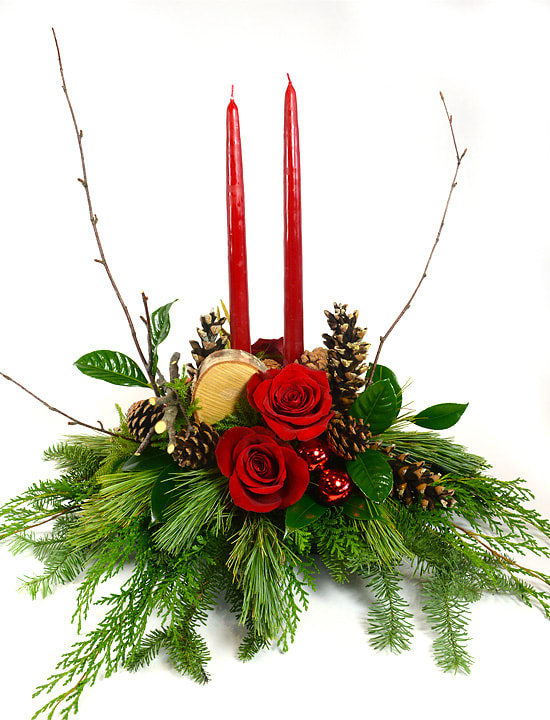 Woodlane Christmas - A traditional centerpiece is filled with fragrant pine, roses, pomegranate candles, cones, and birch. Light up your holidays.