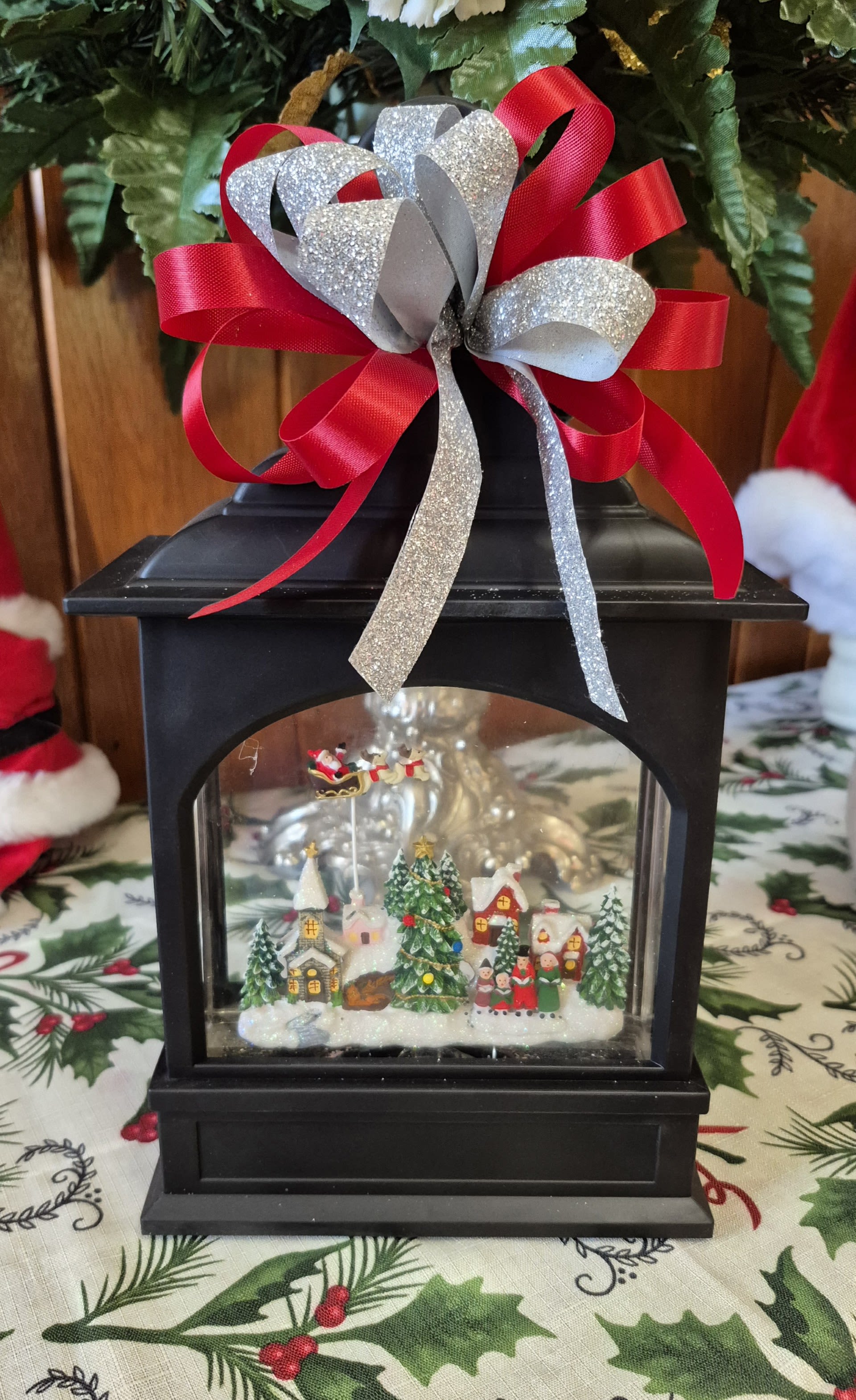 11&quot; Flying Santa Christmas Lighted Water Lantern - Black Made of Plastic Requires 3 C Batteries or Can be operated with USB Cord that is included. 6 Hour Timer Repeats Every 18 Hours Continuous Swirling Glitter, Gently Flip To Loosen Glitter, To Avoid Damage Do Not Shake Does Not Include USB Power Adapter Do Not Use With USB Power Adapter Exceeding 1.5 Amps