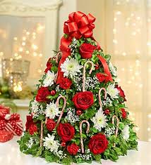 Holiday Flower Table Top Tree - Hand Crafted Boxwood tree with Ribbon, Pine cones, Ornaments, Candy Canes, Mini Carnations and White Cushion Poms.