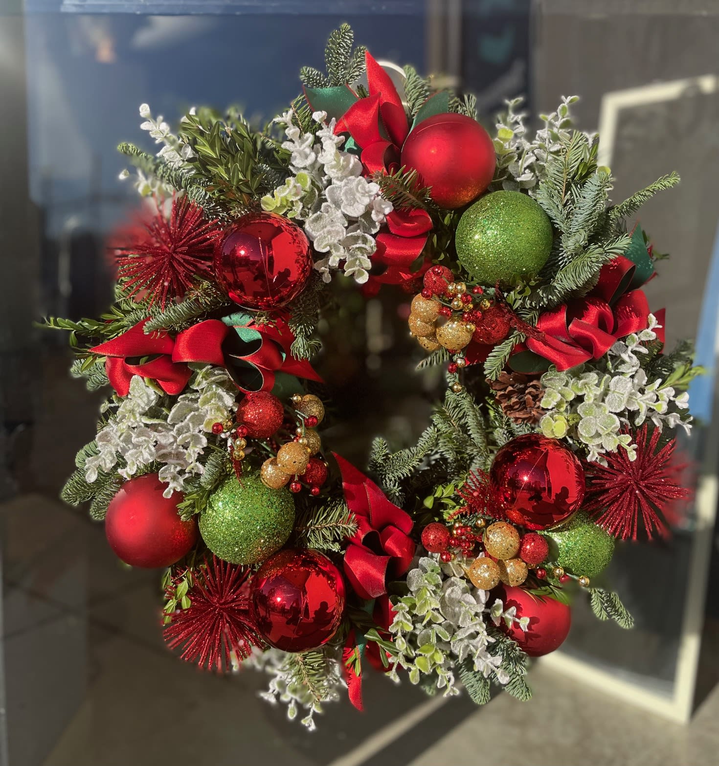 Holiday's Wreath - Assorted evergreens with Christmas decorations. Approximated size: 24&quot;