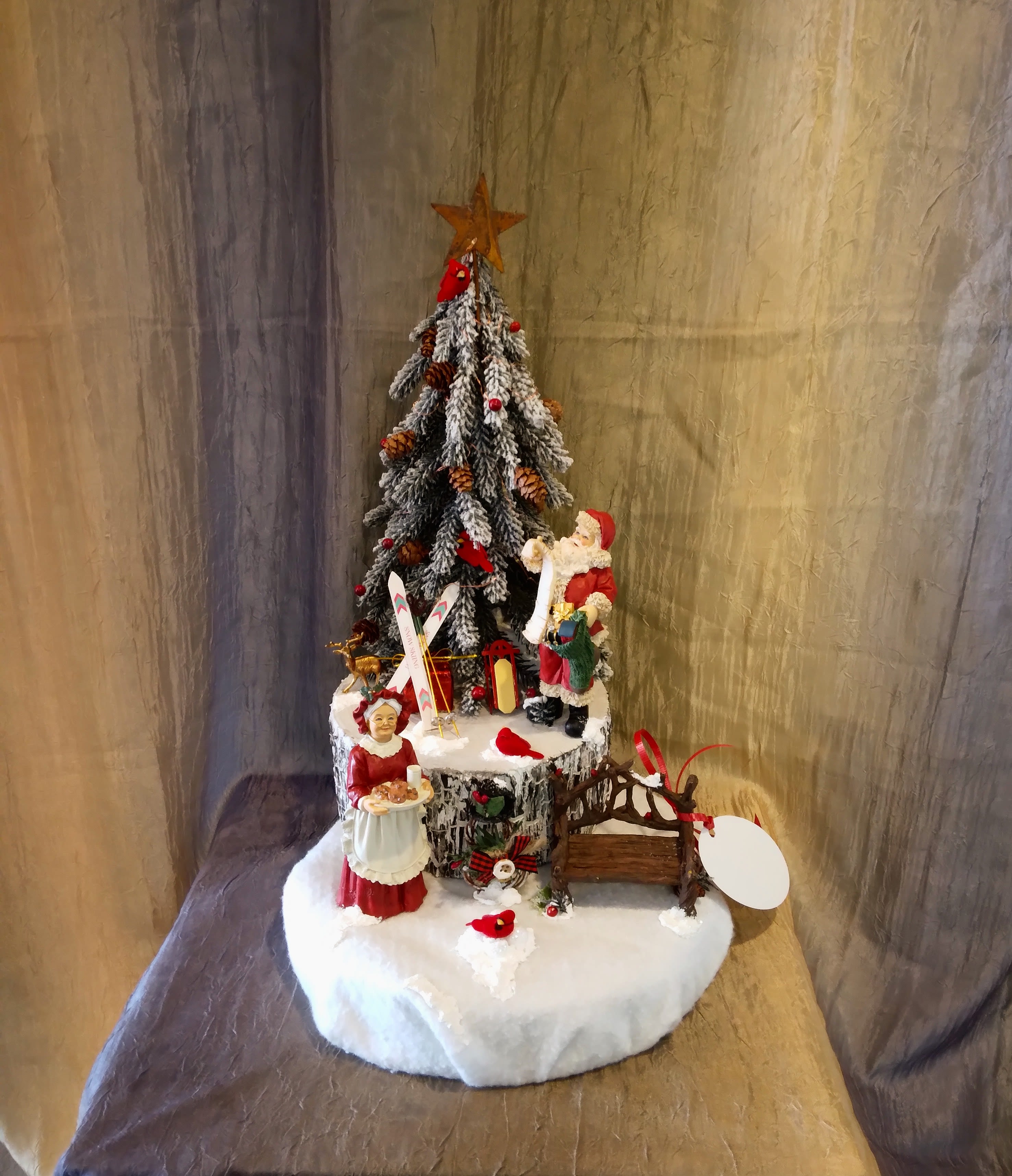 Celebrate with The Claus' (Artificial Arrangement) - This is an Artificial Arrangement that contains LED lights. Perfect long-lasting decor that you can bring out every year!