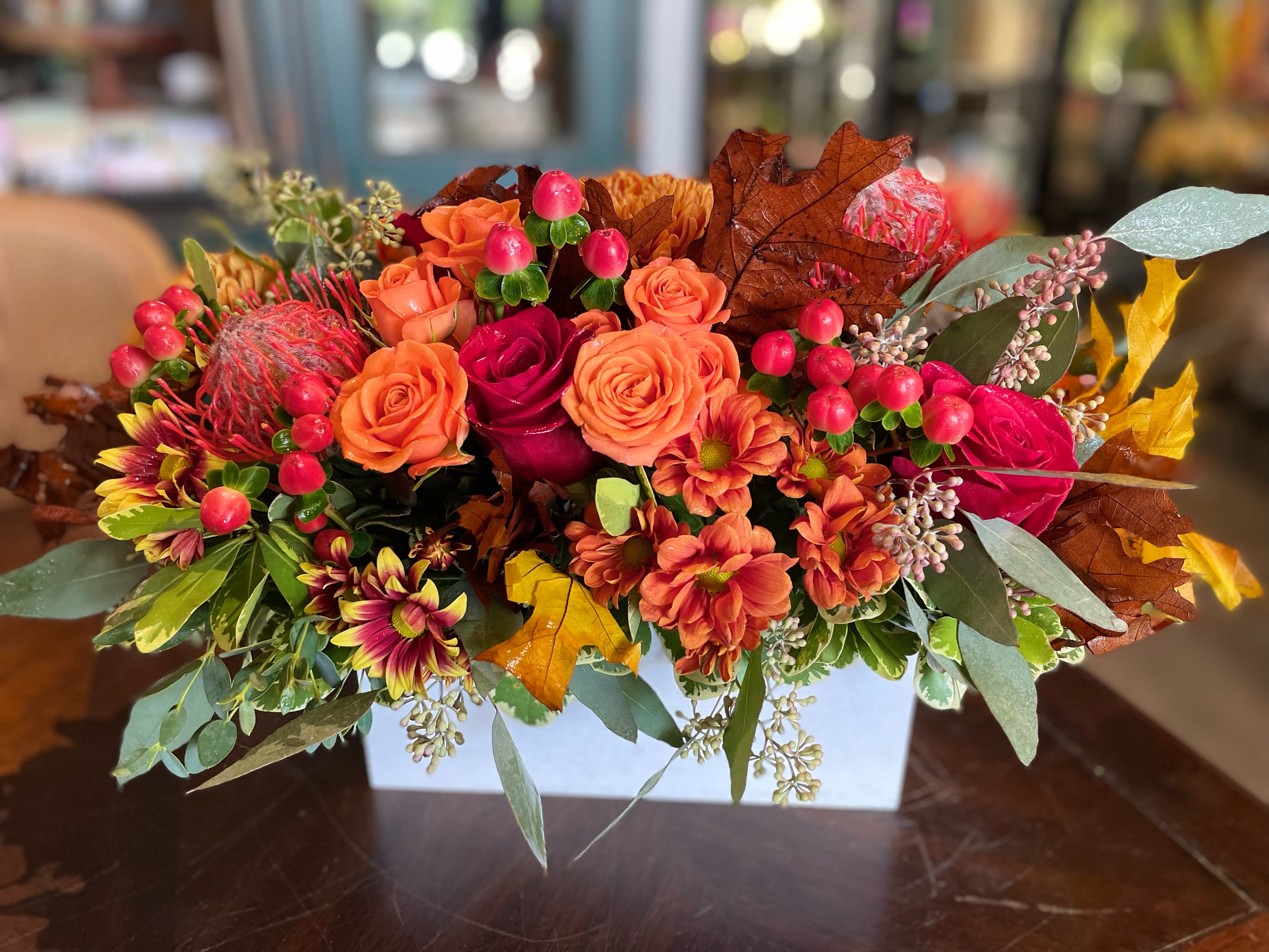 Box of Autumn - Wouldn’t life be more convenient if seasons came in boxes? We already have boxed wine, boxed lunches, and boxing matches. Seasons need to catch up. Now they have. Introducing the Box of Autumn by Belden's Florist. Whoever you’re sending this to will smile with seasonal joy upon receiving this abundant box of seasonal blooms.  **container may vary**