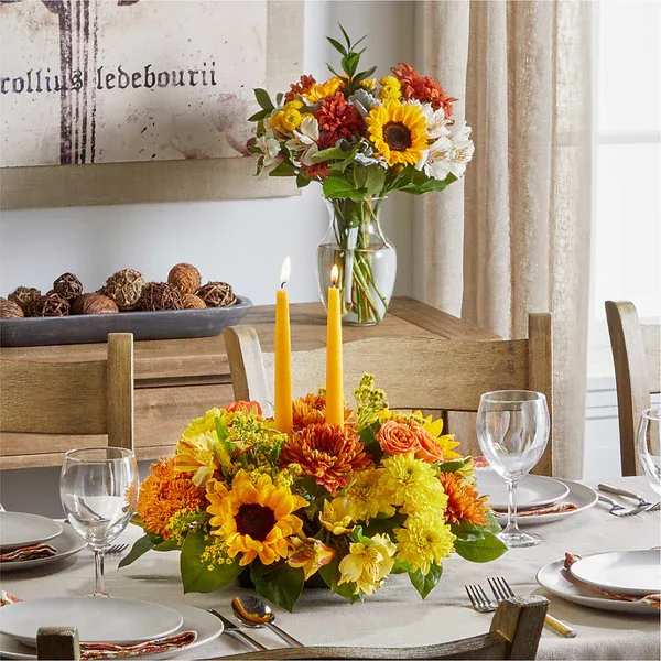 Golden Gathering Bundle - A stunning centerpiece and bouquet duo to bring autumn color to any gathering.  Details The Premium Bouquet is approximately 21"H x 20"W. The Premium Centerpiece is approximately 9"H x 20"W. Designed by florists, ready to display. For long–lasting blooms, replace the water daily. We suggest trimming the stems every couple days. Pet Safety Precautions: This bouquet or plant may include flowers and foliage that are known to be toxic to pets. To keep them safe, be sure to keep this arrangement out of your pet's reach.