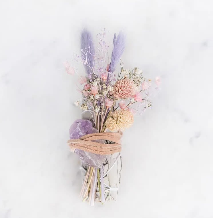 Purple Cleanse Bundle - Sage Smudge Stick with Amethyst Crystal, Palo Santo and Mini Dried Flower Bundle. The bundle with a purpose! Each bundle will vary and is approx 4&quot;.   Amethyst - Purifies the mind, for calming and clearing the mind and body, provides a protective shield of light, enhances memory, creativity, passion and focus.    *Just like people, all mineral crystals are unique - varying in size and shape.