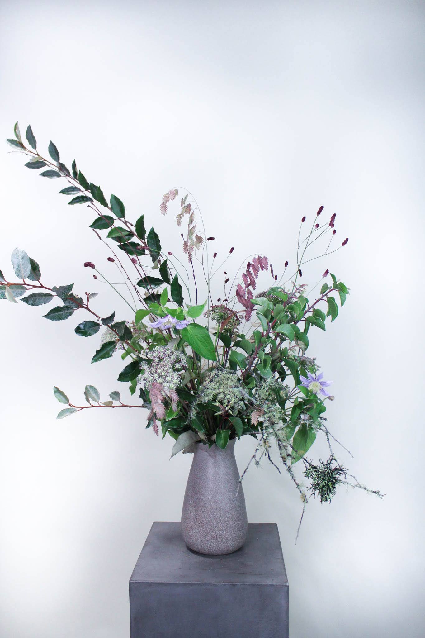 Woodland Greens  - A highlight of this season's most gorgeous greens. Designed with minimal blooms as a nod to Winter and all it has to offer.   *Images are a representation of our design style. Each arrangement is made to order and flower selection will vary due to product availability the week of your order.