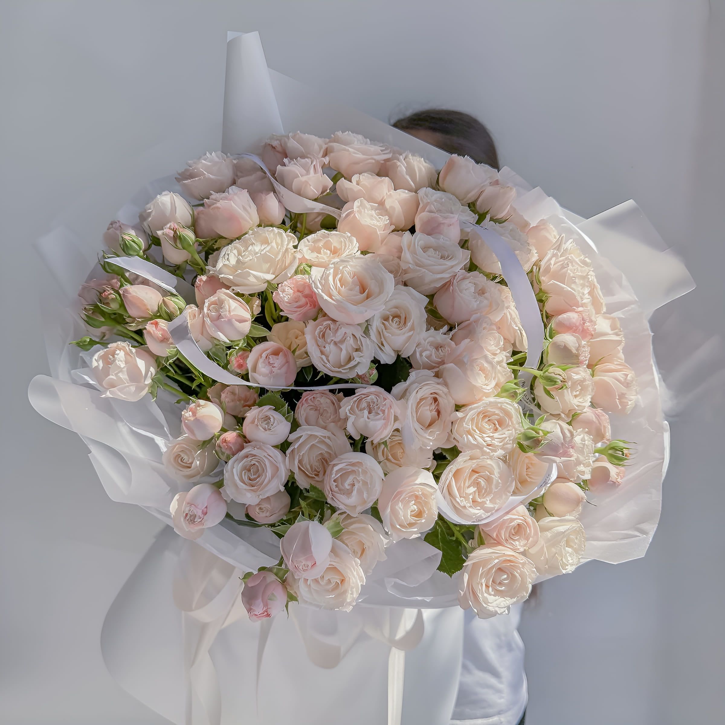 Milky Rose - A refined bouquet of blush and ivory spray roses, Milky Rose exudes tenderness, elegance, and quiet charm. Its soft creamy palette makes it a graceful choice for weddings, anniversaries, or moments when words aren’t enough to express your care. Size on the photo: Premium