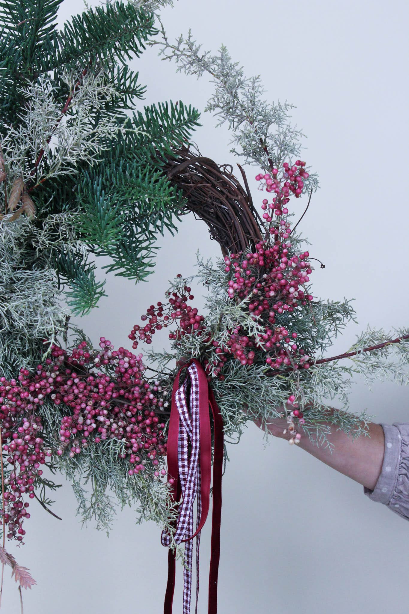 Evergreen Door Wreath - The perfect evergreen wreath to fit any front door.   *Images are a representation of our design style. Each arrangement is made to order and flower selection will vary due to product availability the week of your order.