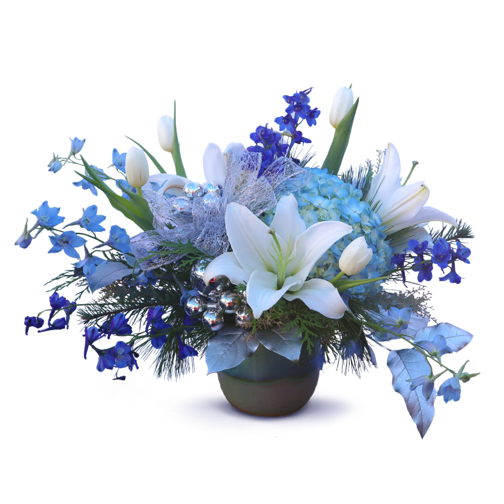 Starlight Blooms - Bring winter in a vase home with you. An arrangement of dark blue delphinium, hydrangea; white lilies and tulips and a spray of cedar greens. Perfect as a centerpiece or a luxurious seasonal gift!