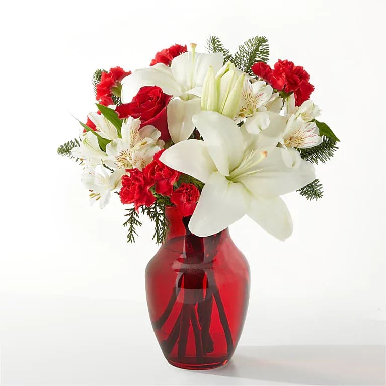 Eckert Florist's FTD Holiday Season Bouquet - This ruby red stunner makes an excellent gift to spread joy and cheer all season long. *Flower and greens varieties may vary