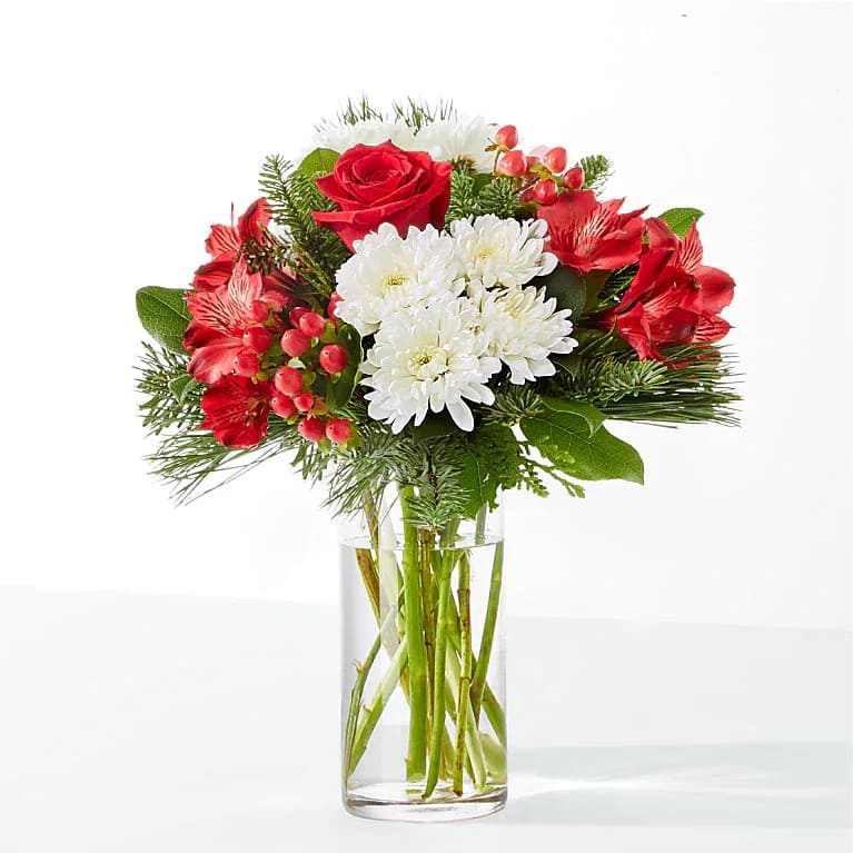 Eckert Florist's FTD Letters to Santa Bouquet - Whether you're sending these as far as the North Pole or just next door, the blooms of our Letters to Santa Bouquet are sure to enchant and delight. *Flowers, vase and greens varieties may vary.