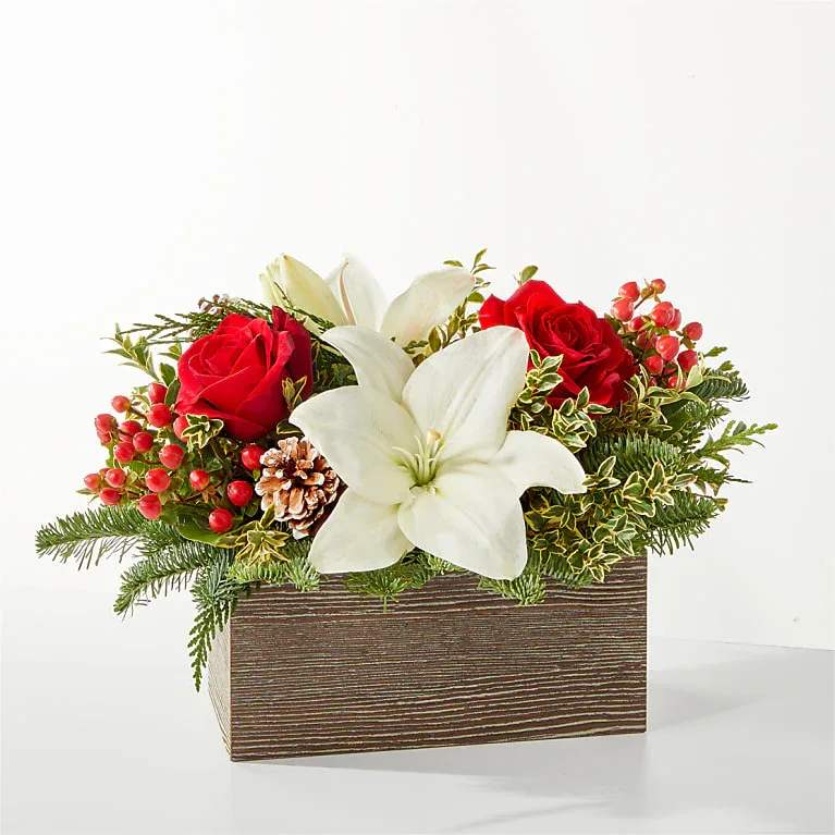 Eckert Floris's FTD Snowy Wonderland Bouquet -  A snowy blend of red and white blooms makes this bouquet the perfect piece to center a table or mantle, share best wishes or celebrate the season. *Flower, container, and greens varieties may vary