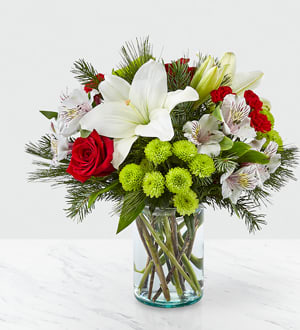 Eckert Florist's FTD Christmas Spirit Bouquet - Make the most of the holiday season with a bouquet that captures the spirit of Christmas. This fresh arrangement is designed with classic shades and modern texture. *Flowers, foliage, and vase may vary.
