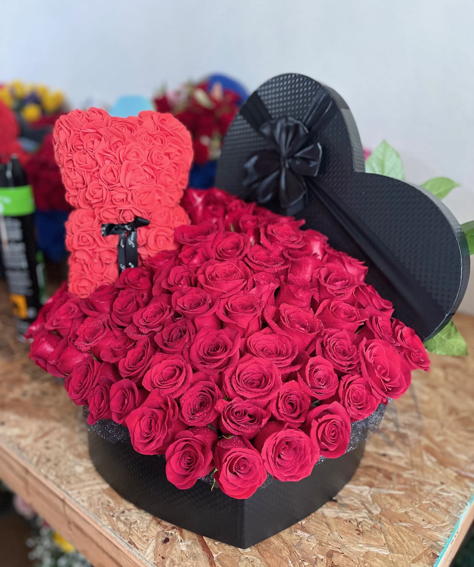 Grand Rose Box - Extra large heart-shaped box filled to the brim with fresh-cut roses and accents of assorted greenery.  Rose color(s) can be selected by the customer. Rose Bear included! (Color may vary) 
