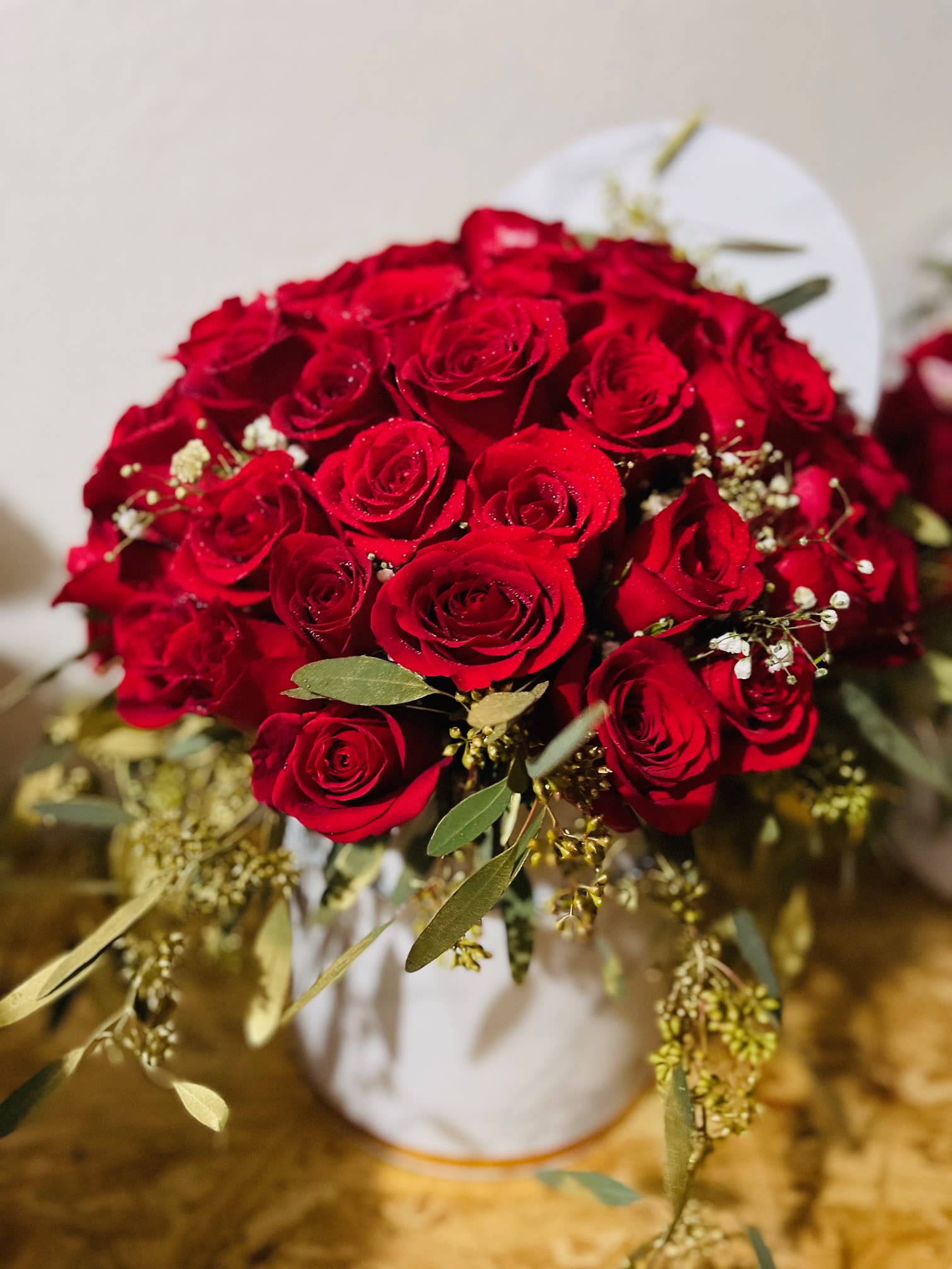 Roses in a box - Gorgeous aromatic roses with greenery in a black, white, or red box. Multiple rose colors to chose from or mix. Please specify your color preference. 