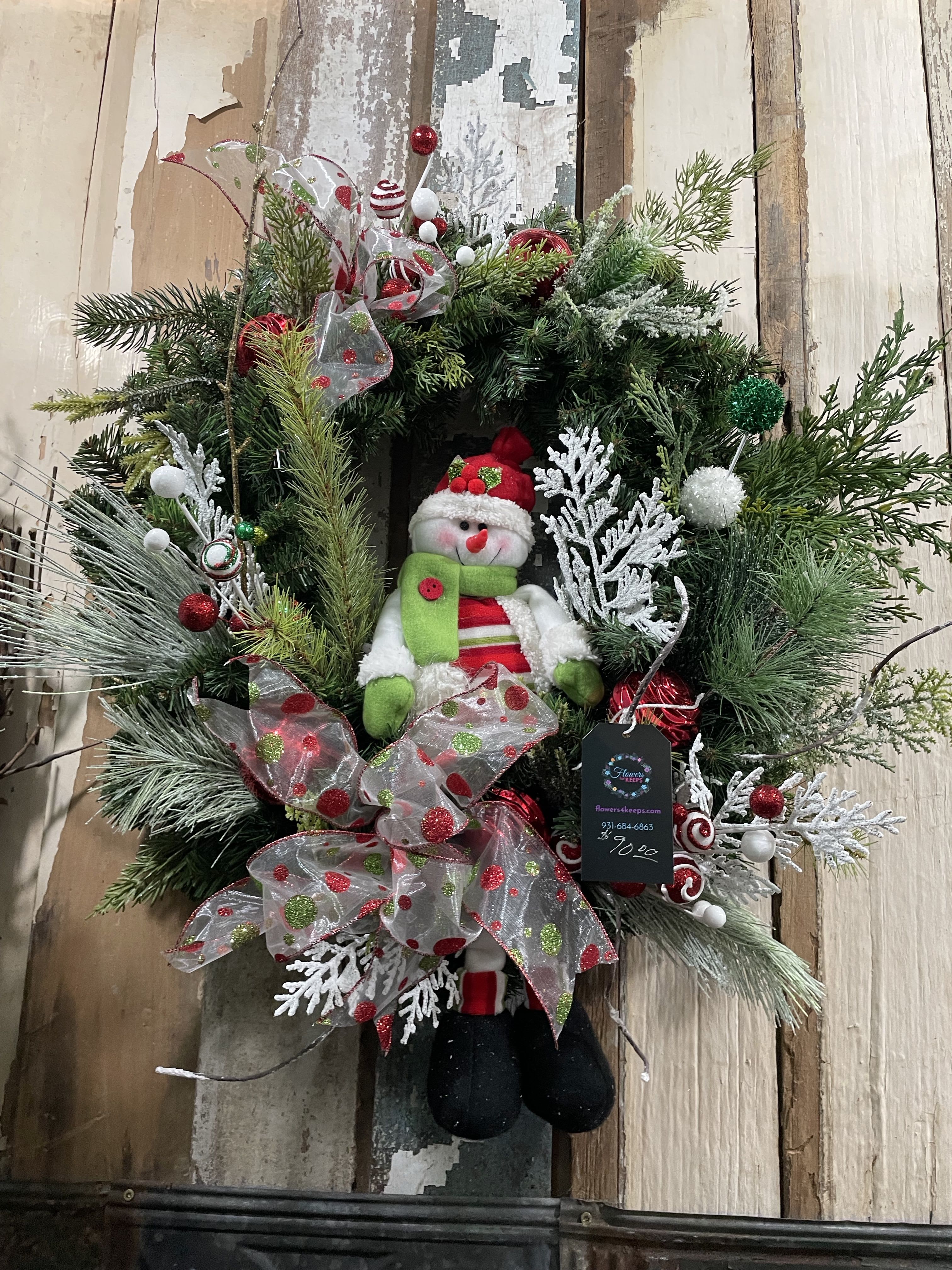 Merry Snowman Christmas Wreath - Our Merry Snowman Wreath is screaming Happy Christmas! Greet your guests in holiday style! Snowmen;  frosted greens , pinecones, ornaments &amp; berries. 