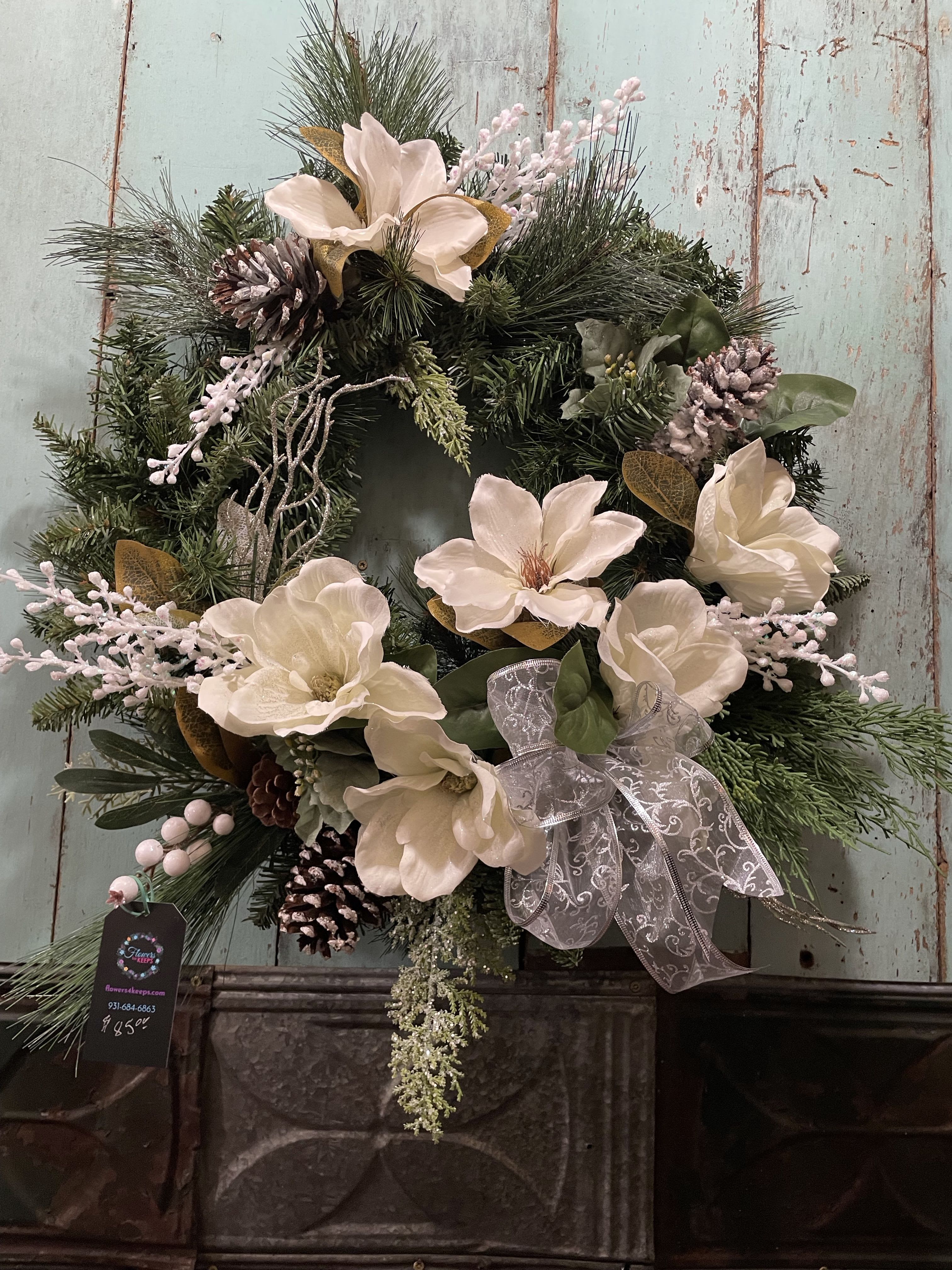 Creamy Magnolia Christmas Wreath - A Christmas Wreath covered in the beautiful seasonal  color and symbols such as creamy magnolias , pine cones, sparkles, and a glistening bow. Enjoy the sparkles of the season.
