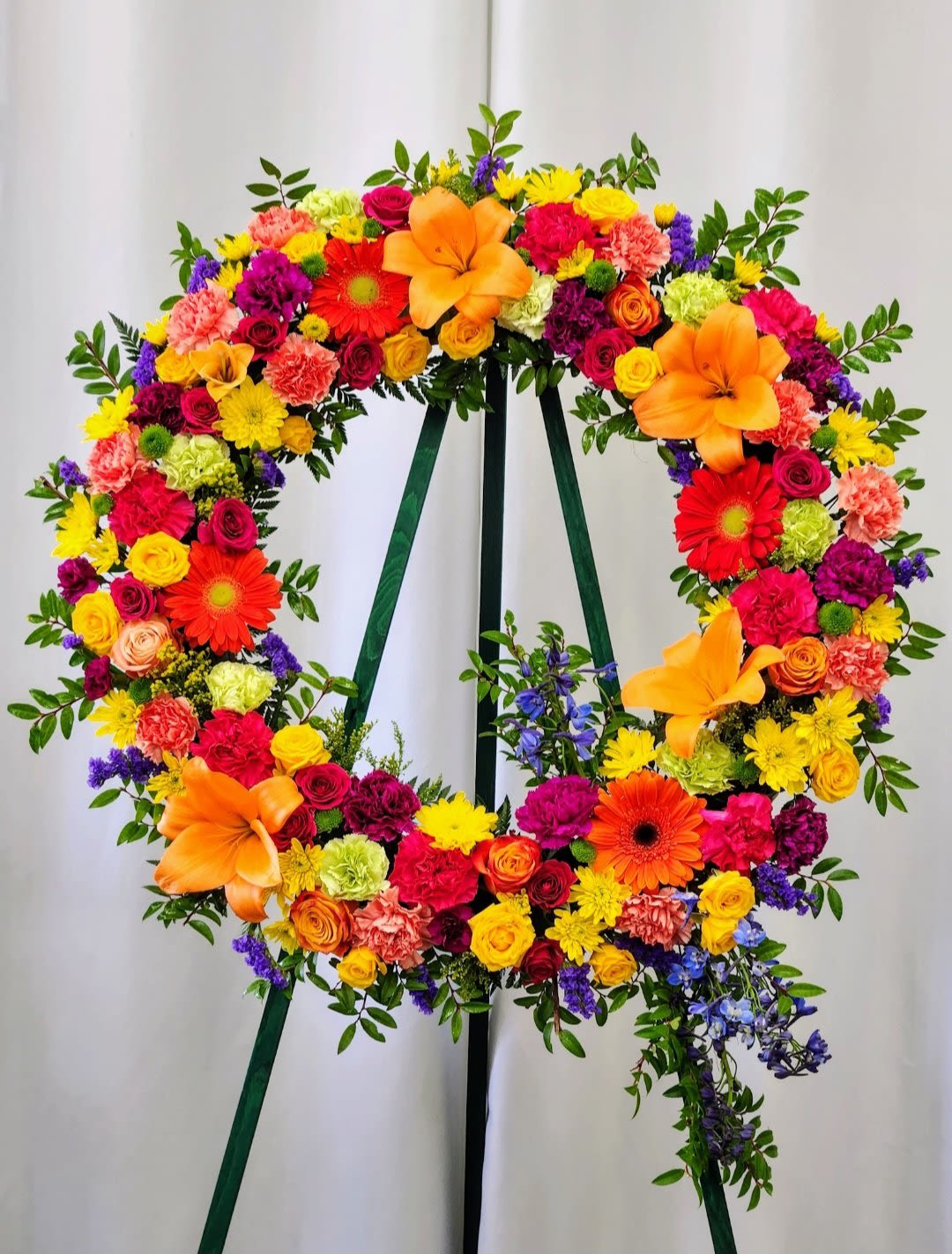 Colorful Life Wreath - Celebrate joy and creativity with the Colorful Life Wreath. Its vibrant mix of bright hues brings a lively, beautiful touch to any door or wall. This stunning wreath adds warmth and cheer.&nbsp; Perfect for expressing a joyful spirit, it’s a simple way to brighten a space with color and life.  Standard: 18"  Deluxe: 24"  Premium - As Pictured (As Pictured): 30"