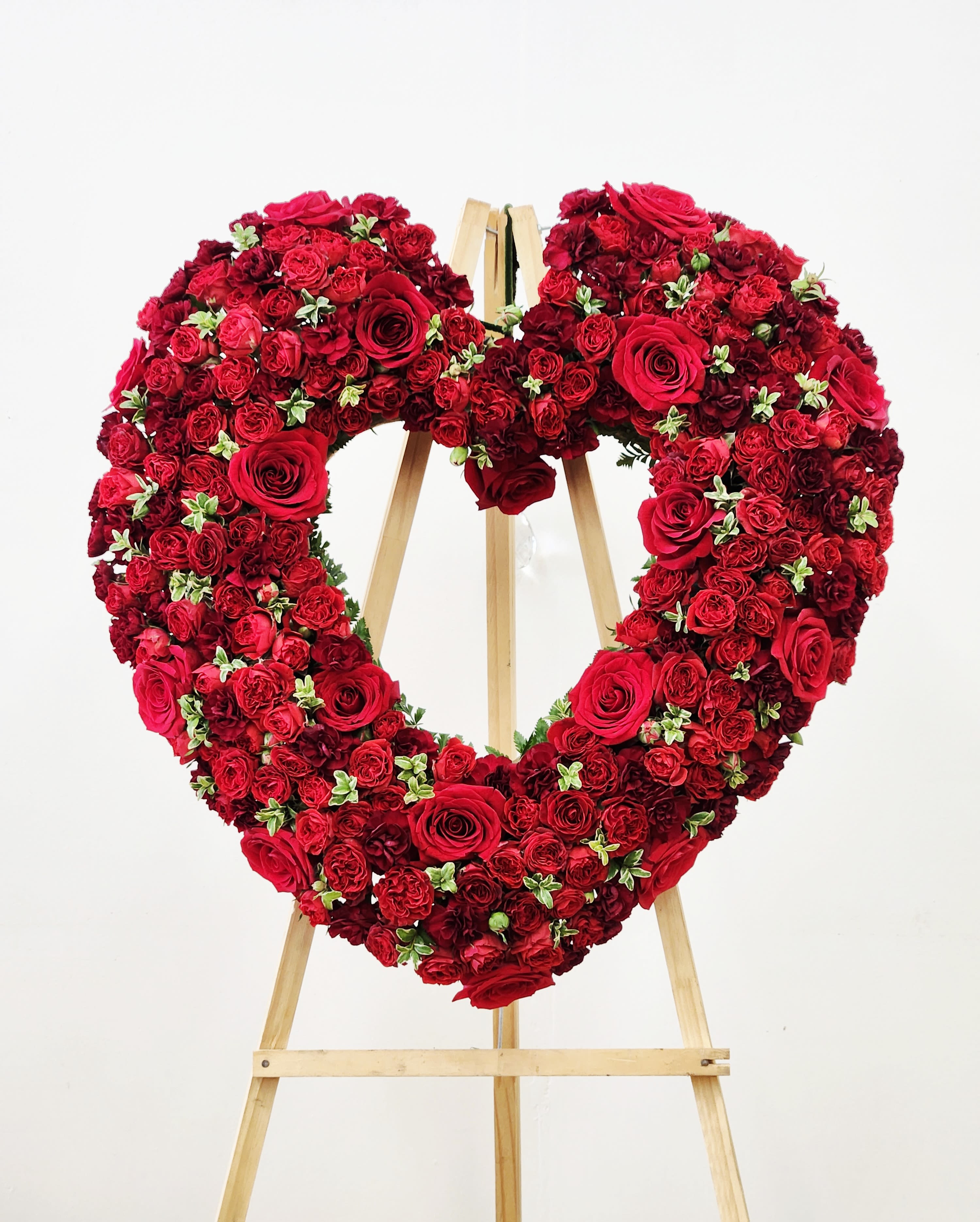 Love You Forever Heart Spray - Express your warm and deep love with the Love You Forever Spray. Featuring red flowers shaped in a heart,&nbsp; this spray embodies enduring affection, perfect for showing someone how much they mean to you every day. Its heartfelt design makes it a meaningful gift or a personal reminder of lasting love. AS PICTURED: PREMIUM 30&quot;