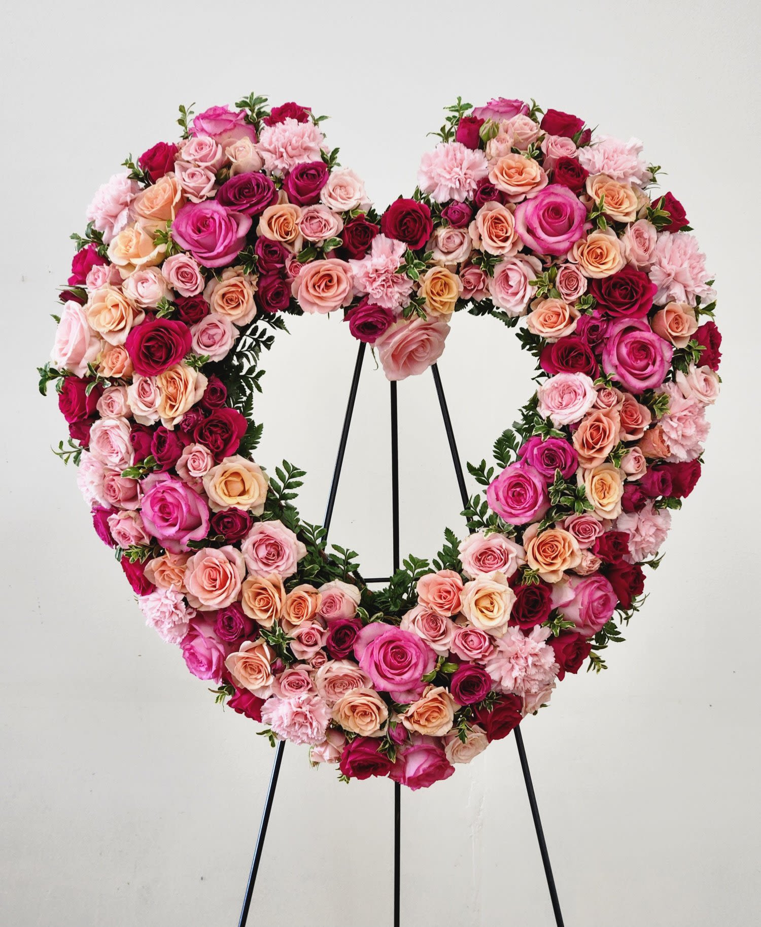 With Love and Comfort Heart - With Love and Comfort Heart A refined composition of soft pastels—blush,&nbsp; soft pink, and sage—creates an atmosphere of quiet solace. Warm undertones throughout the arrangement convey genuine care and compassion, while the heart shape speaks to deep affection. Each bloom is thoughtfully selected to balance elegance with comfort, making this an ideal tribute for moments when words alone aren't enough. A graceful expression of love and support.