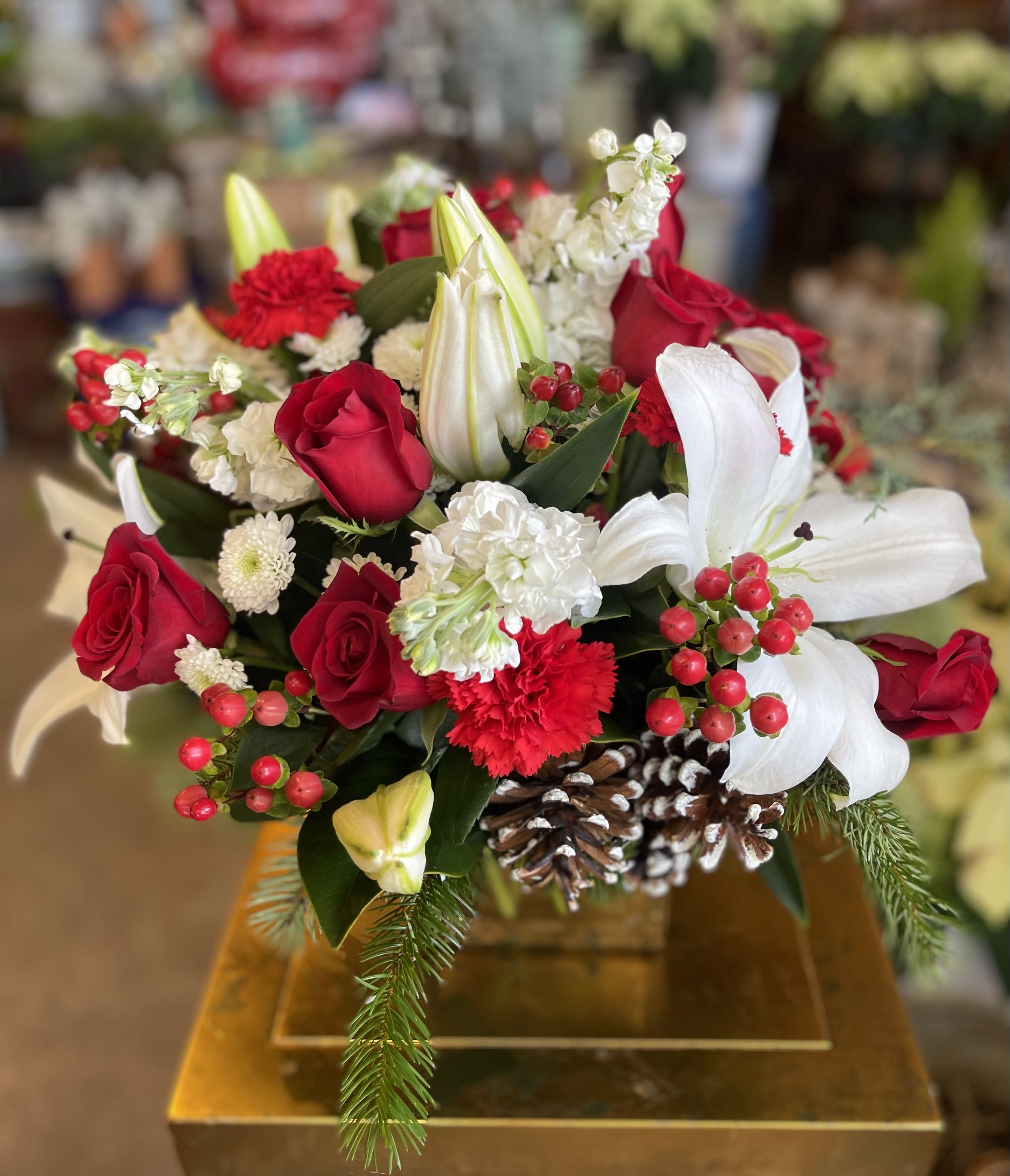 Christmas Is Here - A beautiful 6&quot; glass cube container filled with traditional Christmas flowers &amp; evergreens.
