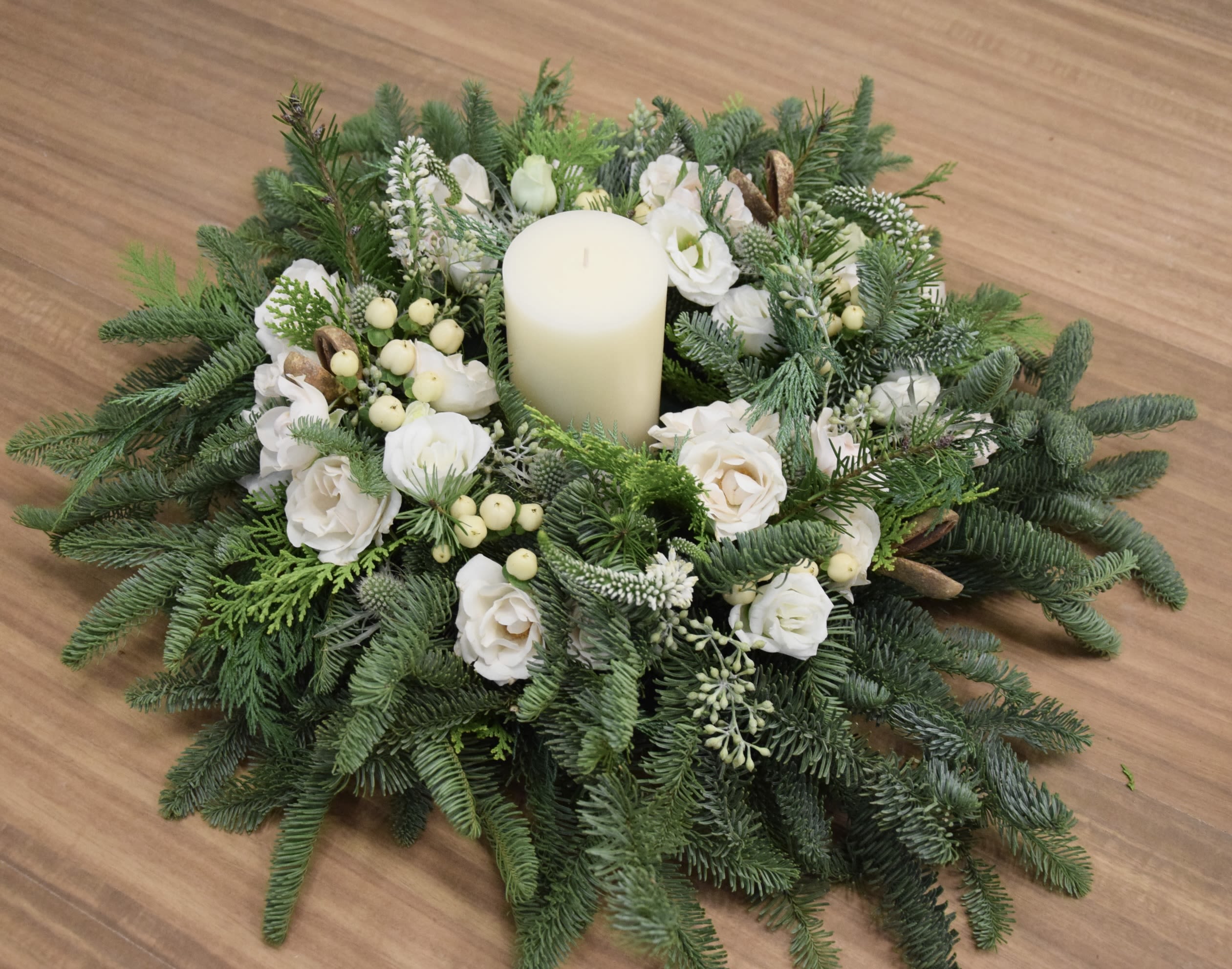 White Table Holiday Wreath with Candle - Personally handcrafted table wreath by yours truly - a festive table wreath made on a 10,5inch round design tray with white blooms and berries, with long lasting fragrant evergreens. It comes with a candle. 