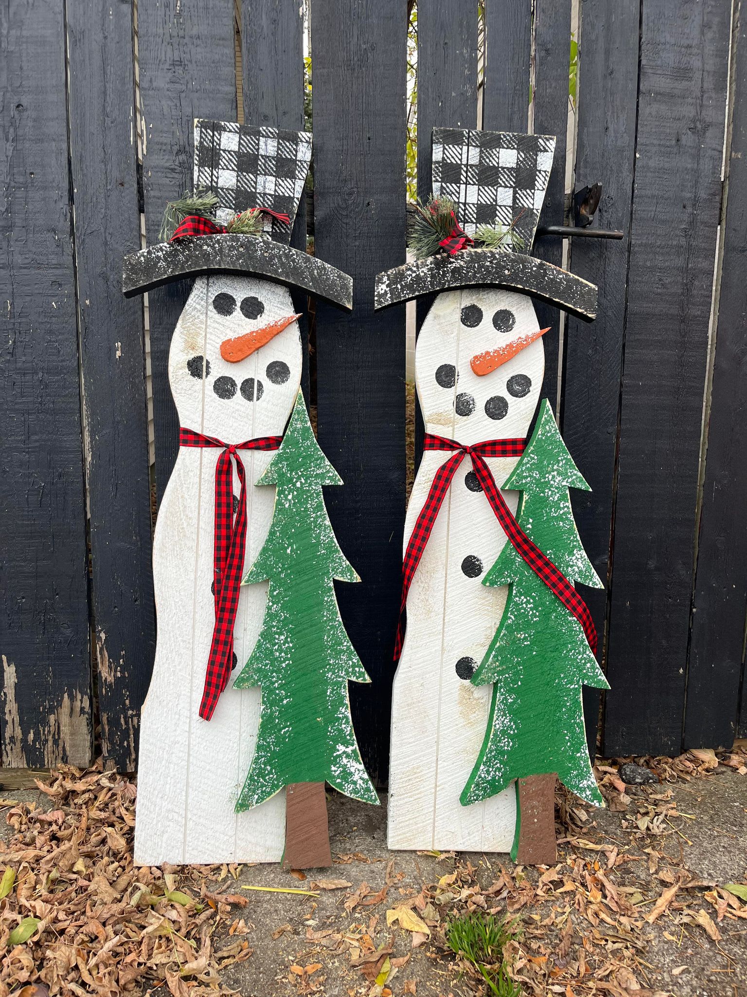Frosty the Snowman with Tree - 40&quot; Wooden frosty the snowman with tree, hat and scarf. Leaner.   1 Frosty @ $50.00 2 Available.   Made in the USA