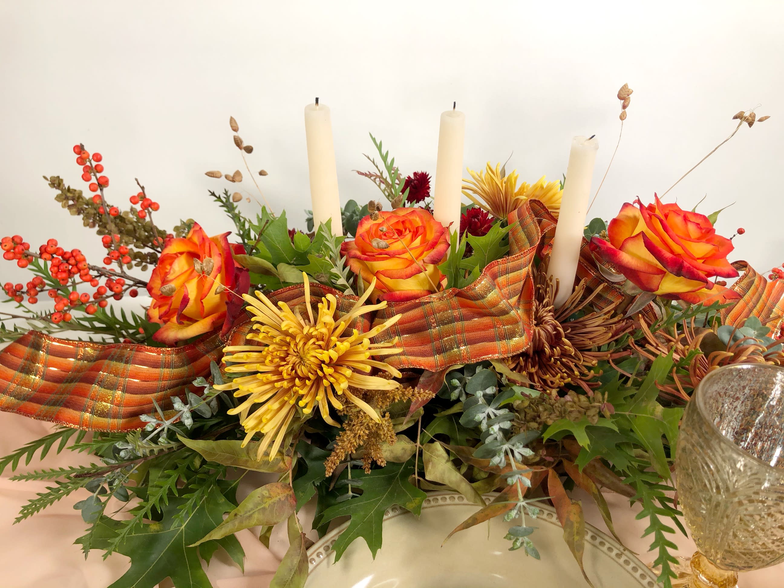 Giving Thanks - Adorn your Thanksgiving table with a fall inspired design or send to a loved one whom you won't be able to spend time with this holiday season to let them know you are thinking of them.  Lush fall colors with roses, mums and fall foliage.  Candles are optional, or we can add more florals instead of the candles.