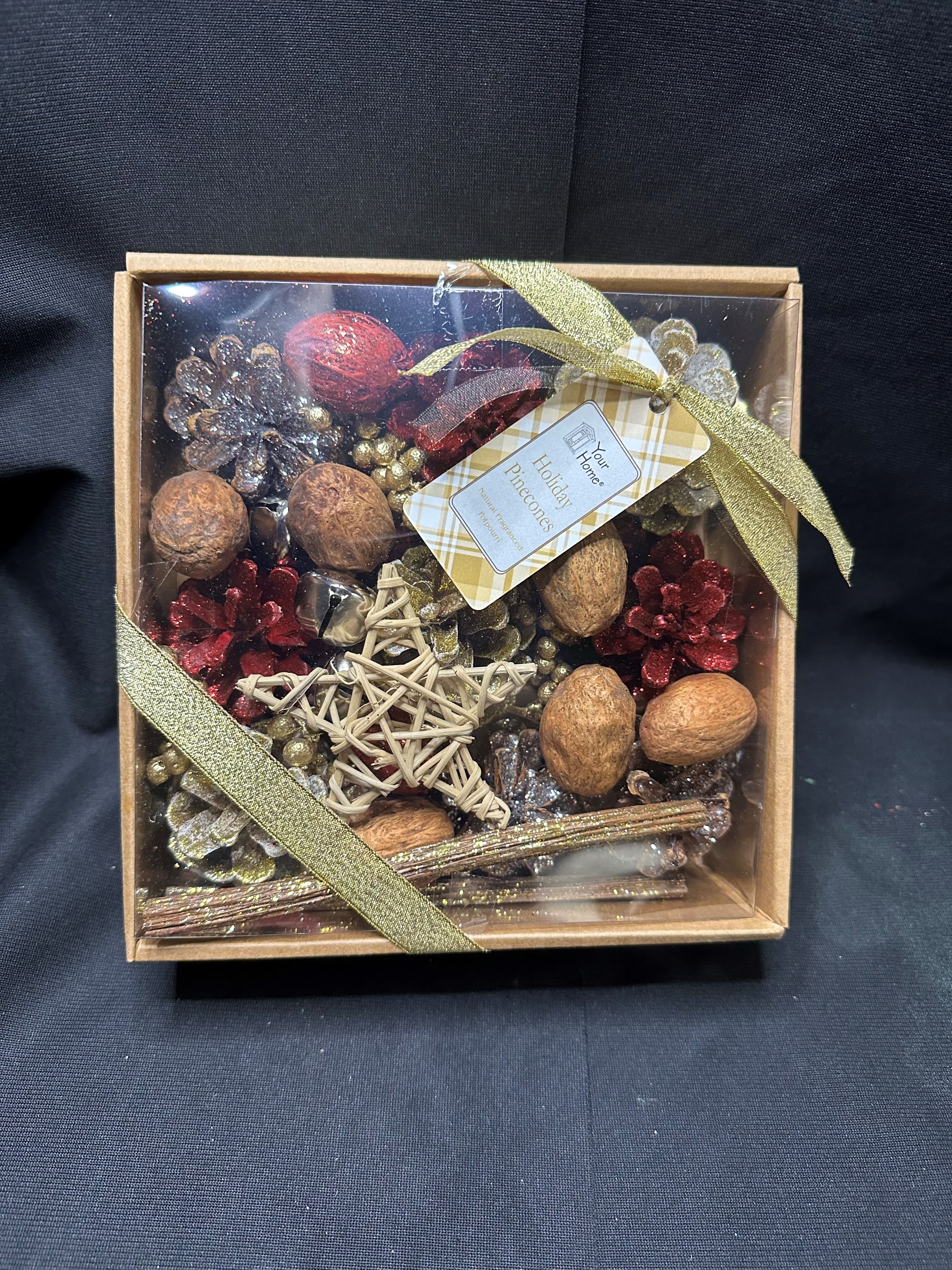 Holiday Potpourri - Add a touch of festive elegance to your home with our Holiday Pinecone Potpourri Gift Set. This beautifully boxed collection features glittered pinecones, cinnamon sticks, walnuts, and decorative accents like a woven star, all infused with a warm and inviting holiday fragrance. Tied with a golden ribbon, it’s the perfect way to create a cozy atmosphere or give as a thoughtful seasonal gift.
